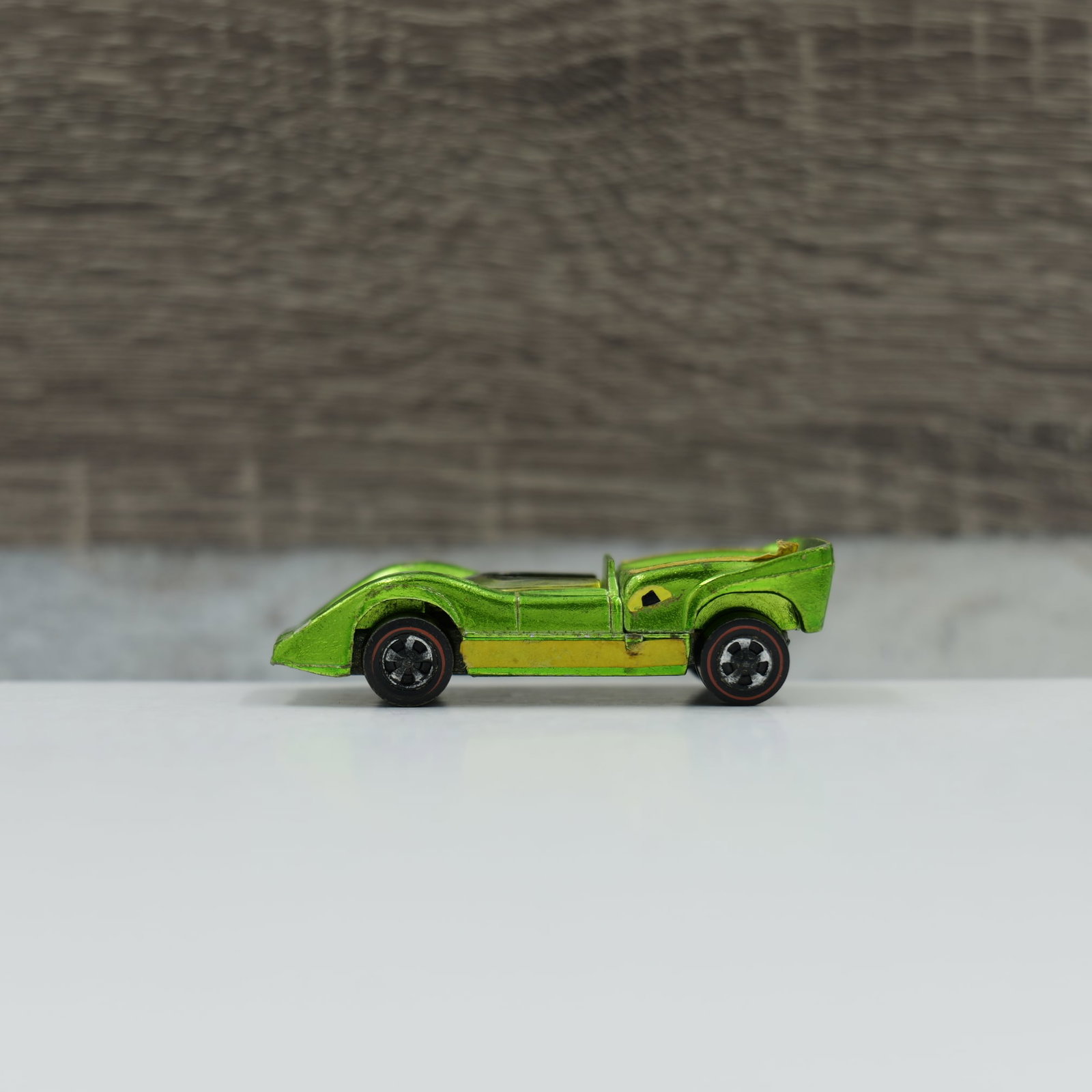 Hot wheels redline McLaren m6a: McLaren M6A, light green. No major toning and hood matches nice, hood pins are good. Wear on fenders mostly. Engine is shiney, base is dullwheels are dull