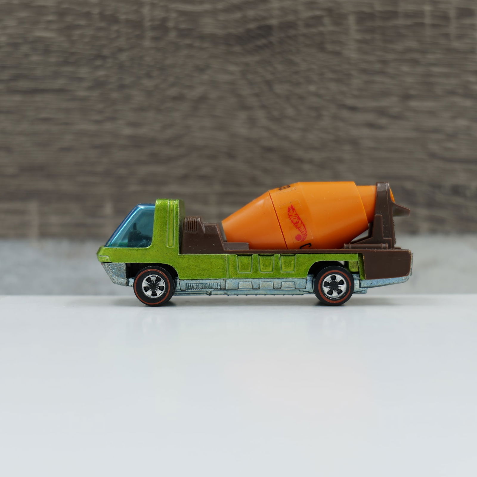 Hot wheels redline Cement mixer: Mixer truck, lime, dark interior. Paint looks super uniform, no major wear. Mixer looks to be original. Glass, wheels and axles are good. Base is gunmetal colored and shiney.