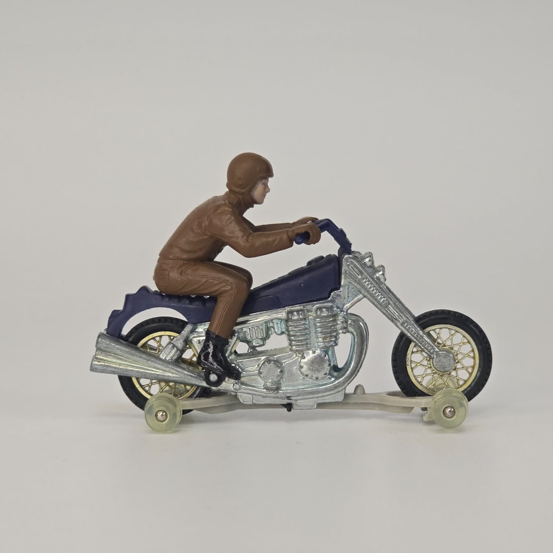 Rrrumblers Road Hog & Hog Wild rider: Road Hog in dark blue and Hog Wild rider in brown with painted face, boots, and foot loops. Die cast shines and the hand and foot loops appear to be intact. Looks to be blister fresh with no visible w