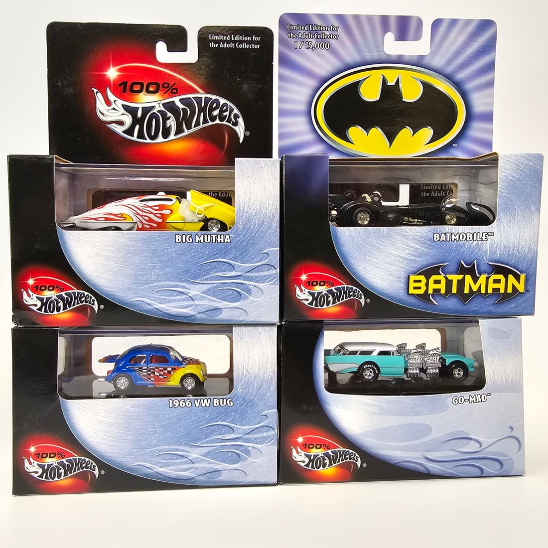 100% Hot wheels lot: (4) 100% Hot Wheels cars including (1) Big Mutha, (1) Batmobile, (1) 1966 VW Bug, and (1) Go-Mad. All boxes/cards seem to be bright with no creases, veins, rips, or holes. All windows appear to be cle