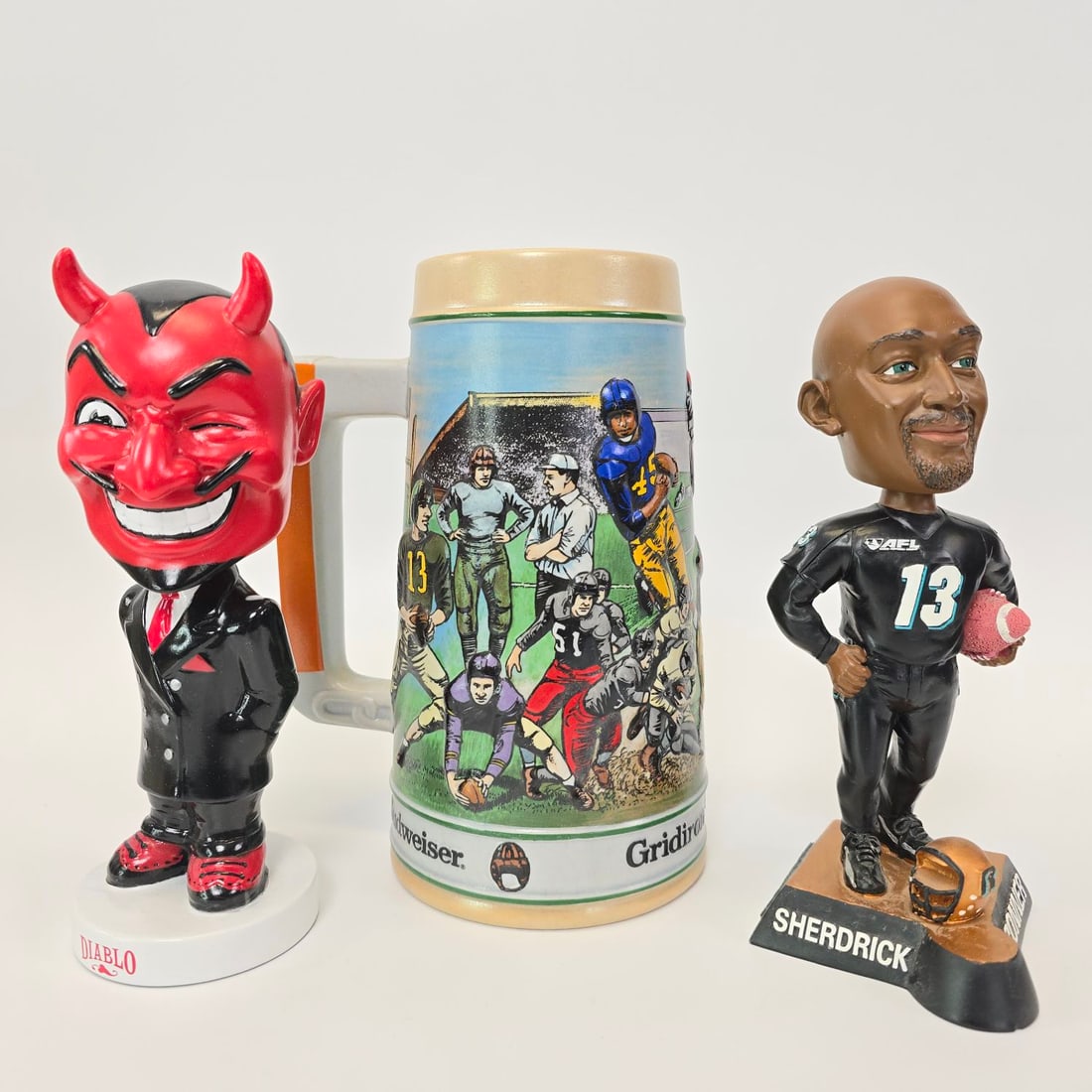 Limited edition, numbered NFL Budweiser stein and bobble head lot (1 of 9)