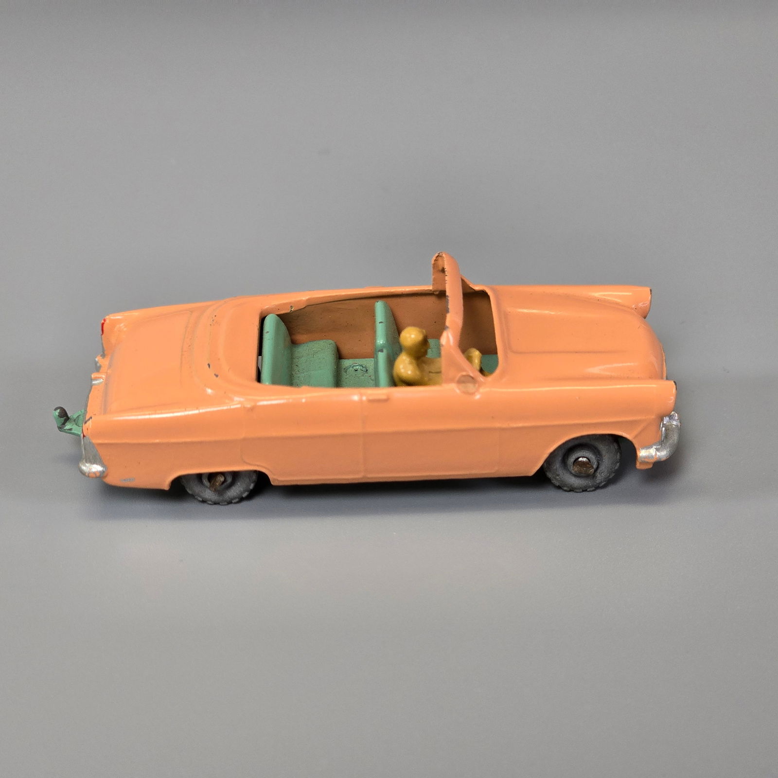 Lesney Matchbox Series Ford Zodiac Convertible: No.39A(2)...1967, pink body, turquise interior and base metal wheels. painted driver. Little to no wear, slight rub on the driver side. Grill, bumber, headlight and tailight deatils are intact
