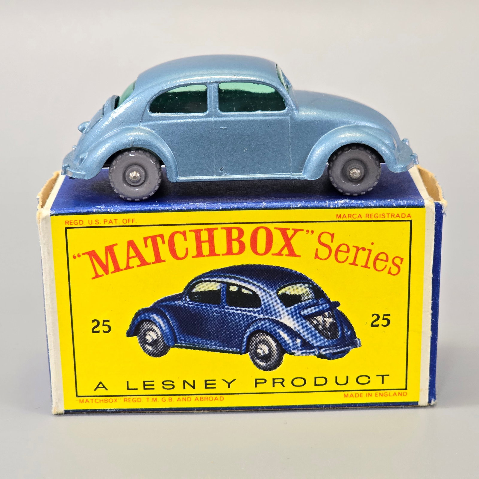 Lesney Matchbox series Volkswagen sedan with box: No.25B(2)....1960, metallic blue body, green glass Gray plastic wheels. No notable wear, rear hood is intact and functions as it should. The box looks to be firm with no rips, holes or creases. 