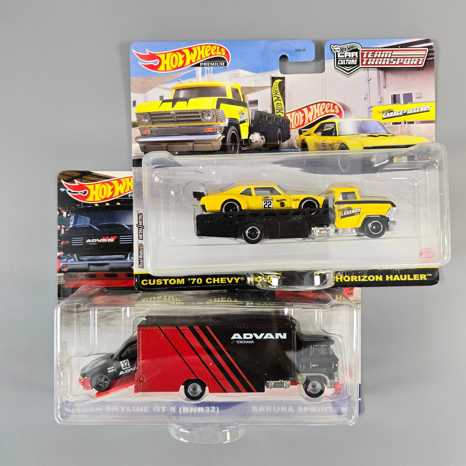 Hot Wheels Team Transport lot including Legends Tour Nova: Includes: Custom 70 Chevy Nova Horizon Hauler and Nissan Skyline GT-R Cards: excellent with the Nova card having a bit of a soft upper right corner, and a few light edge dings Blister/Bubbles: looks t