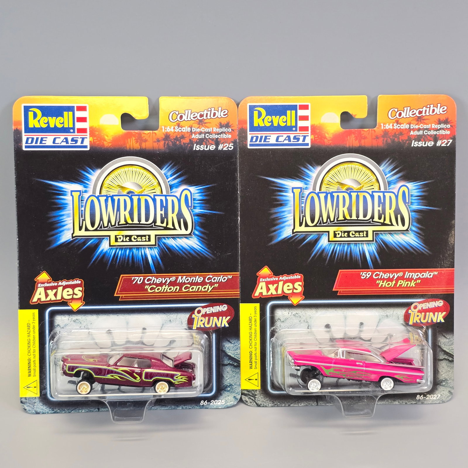 Revell Lowriders pair: Includes: 70 Chevy Monte Carlo "Cotton Candy" and 59 Chevy Impala "Hot Pink" Cards: good to excellent, the Monte Carlo has a slightly dented lower right corner, pictures show it fr