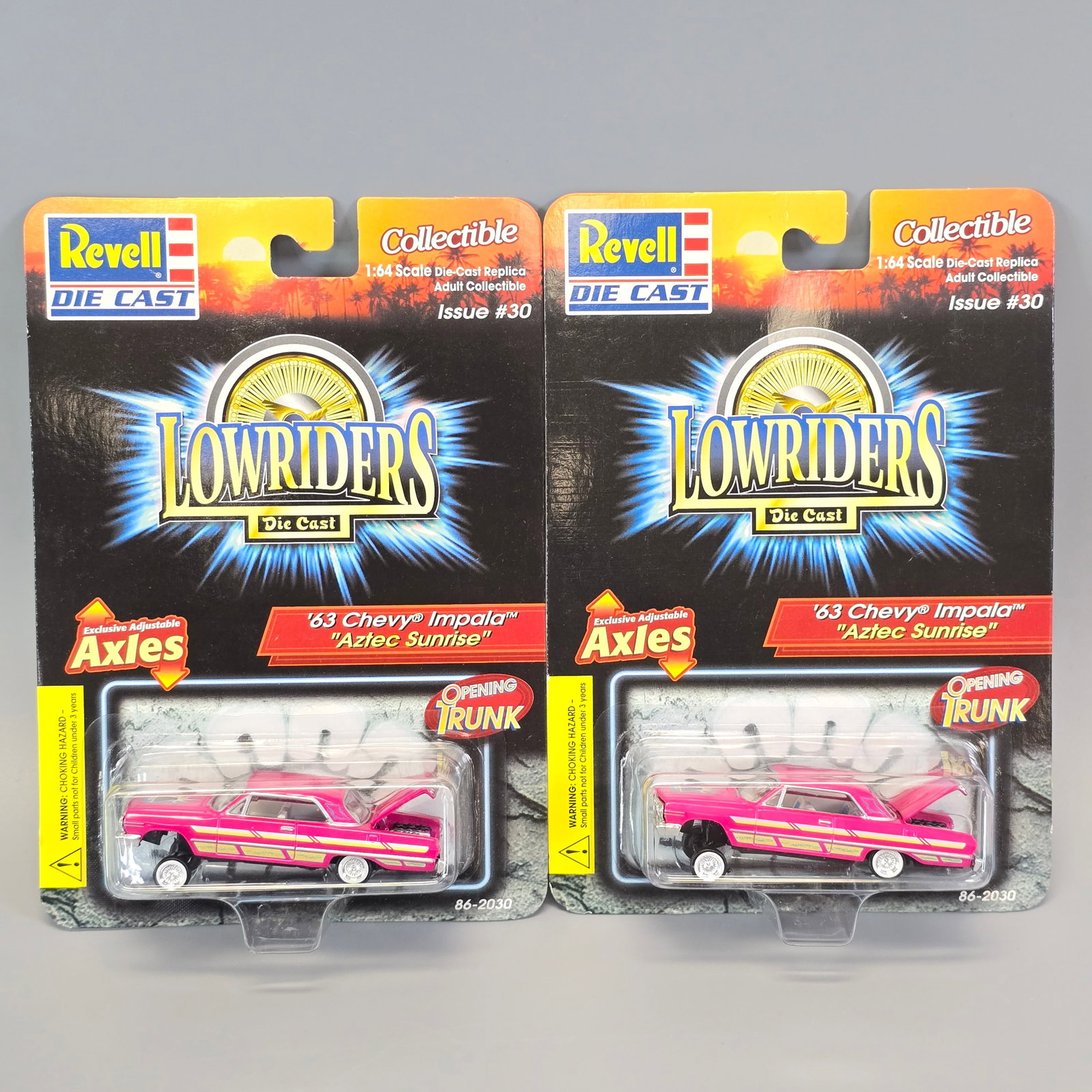 Revell Lowriders pair: Includes: (2) 63 Chevy Impalas "Aztec Sunrise" Cards: very good, both have minor edge wear with one having a pinch in center of bottom edge as seen in the photos