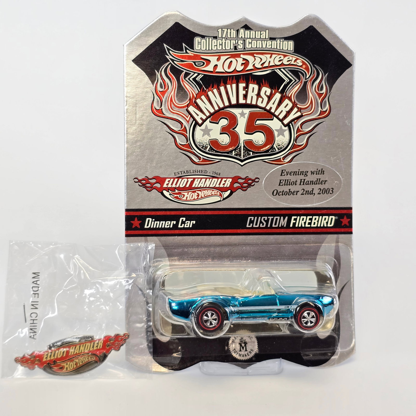 Hot Wheels 17th annual Collectors Convention Custom Firebird and Elliot Chandler Pin: Includes: carded Light My Firebird and commemorative pin Card: excellent with the only blemish being a very light, short vertical line on left side of card, shown in pictures
