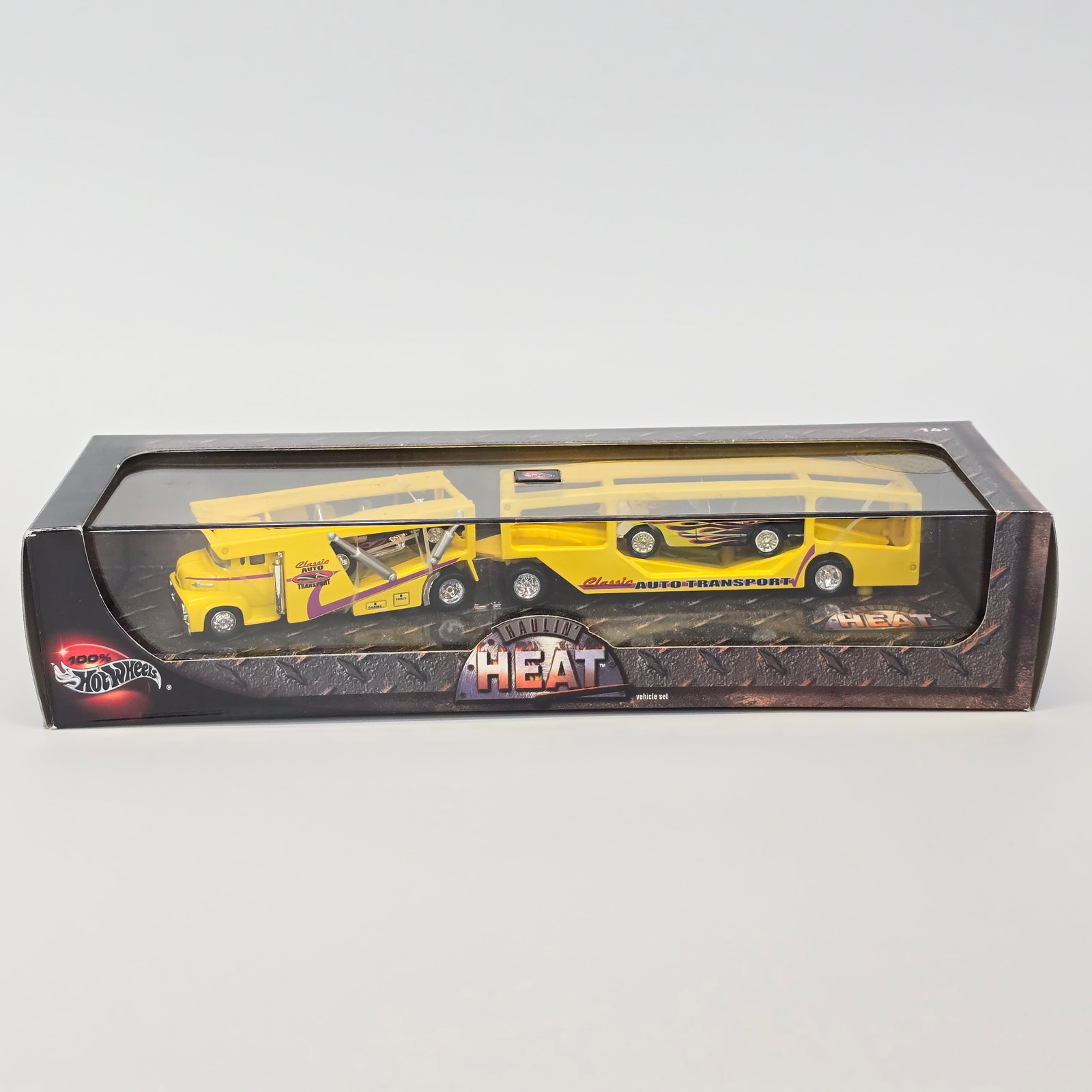 Hot Wheels Haulin' Heat acrylic box set: Box: excellent with light wear on hard edges in spots Blister/Bubbles: look to be clear, little to no wear Items: unopened, no notable