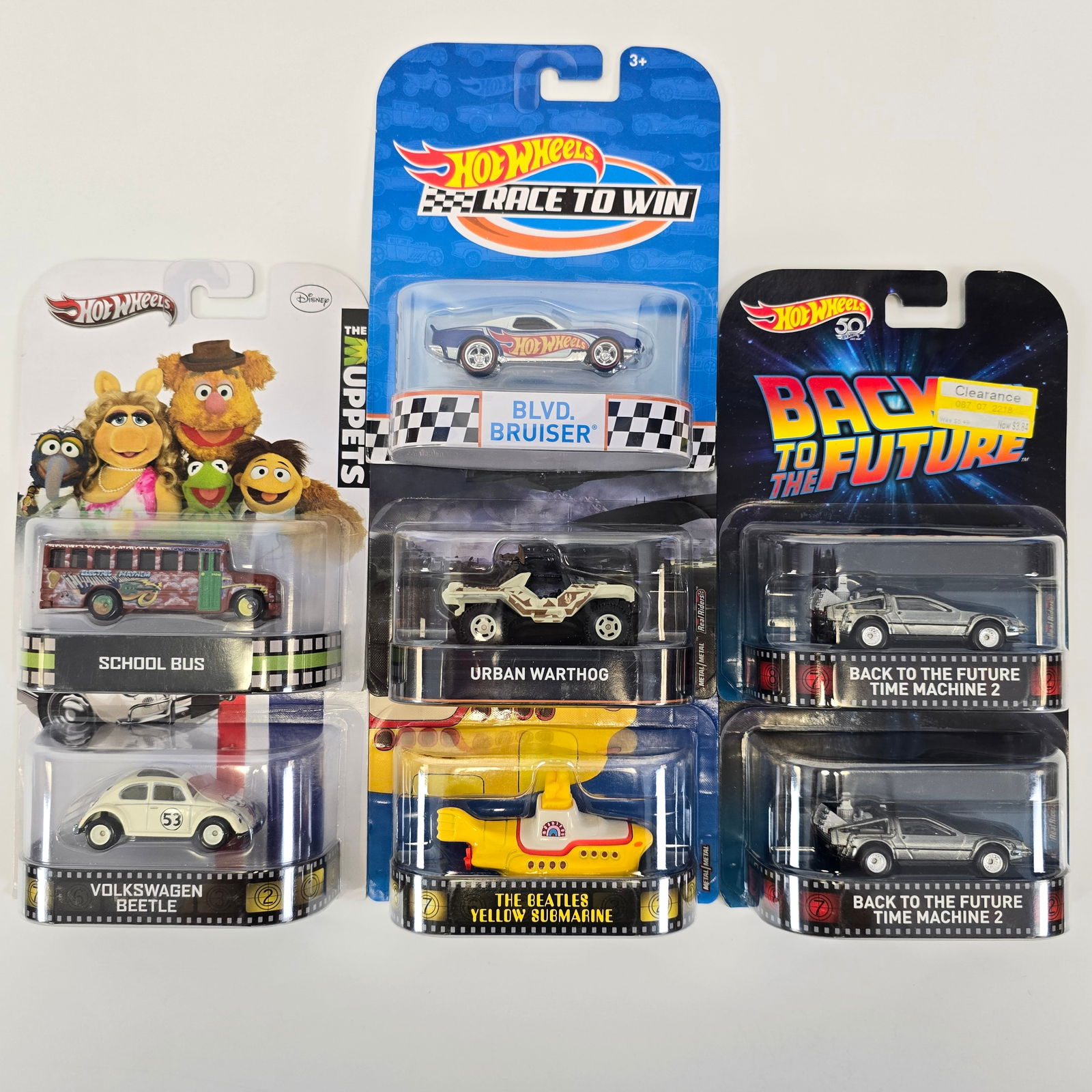 Hot Wheels Entertainment Lot: Hot Wheels Entertainment lot of 7 including, Race to Win Blvd Bruiser, Love Bug Volkswagen Beetle, Muppets School Bus, (2) Back to the Future Time Machine 2's, Halo Warthog and the Beetles Yellow Subm