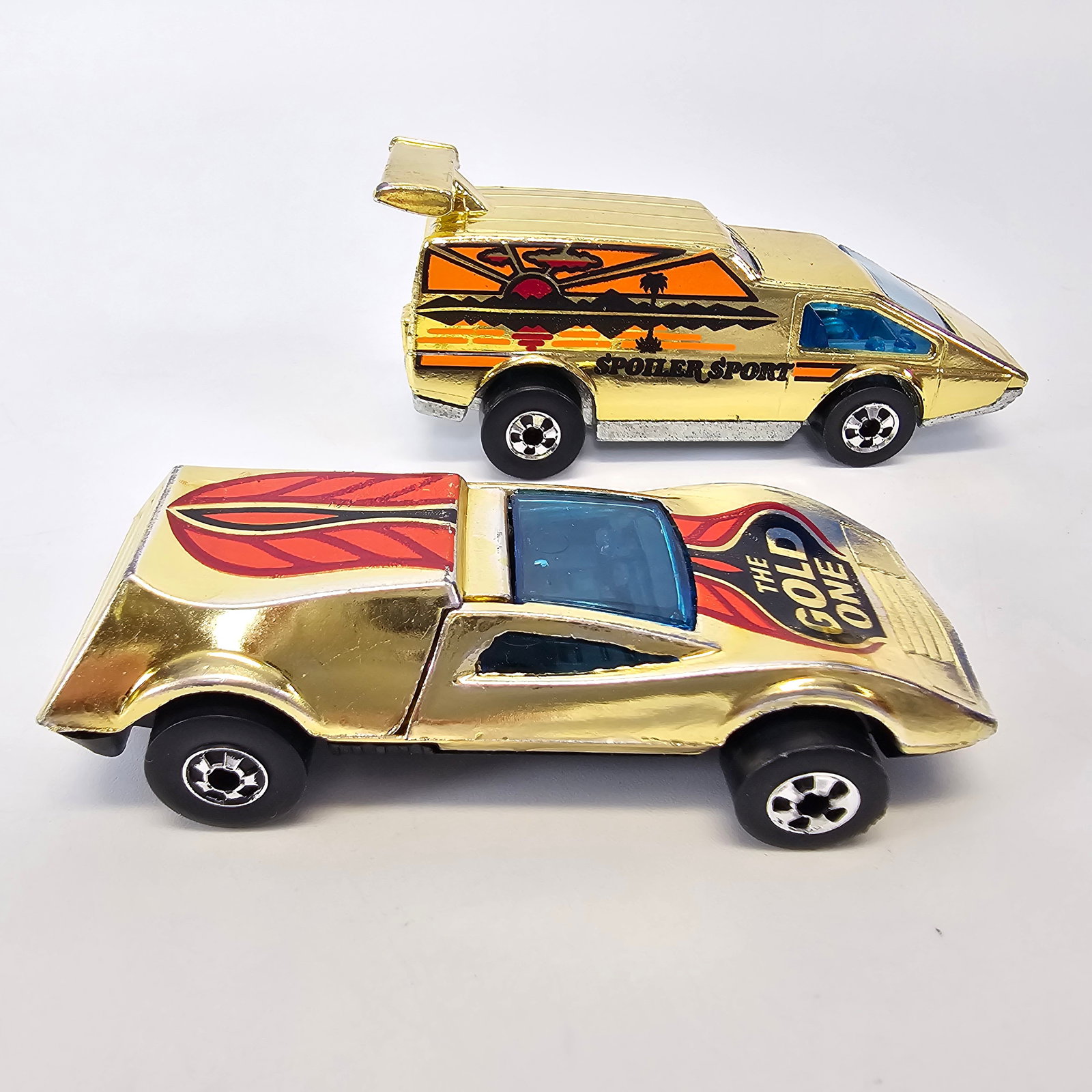 Hot Wheels Gold Buzz Off and Spoiler Sport: Hot Wheels Blackwall Gold lot including; Buzz-Off "The Gold One" and Spoiler Sport Condition; Very good with bright tampos and no notable damage