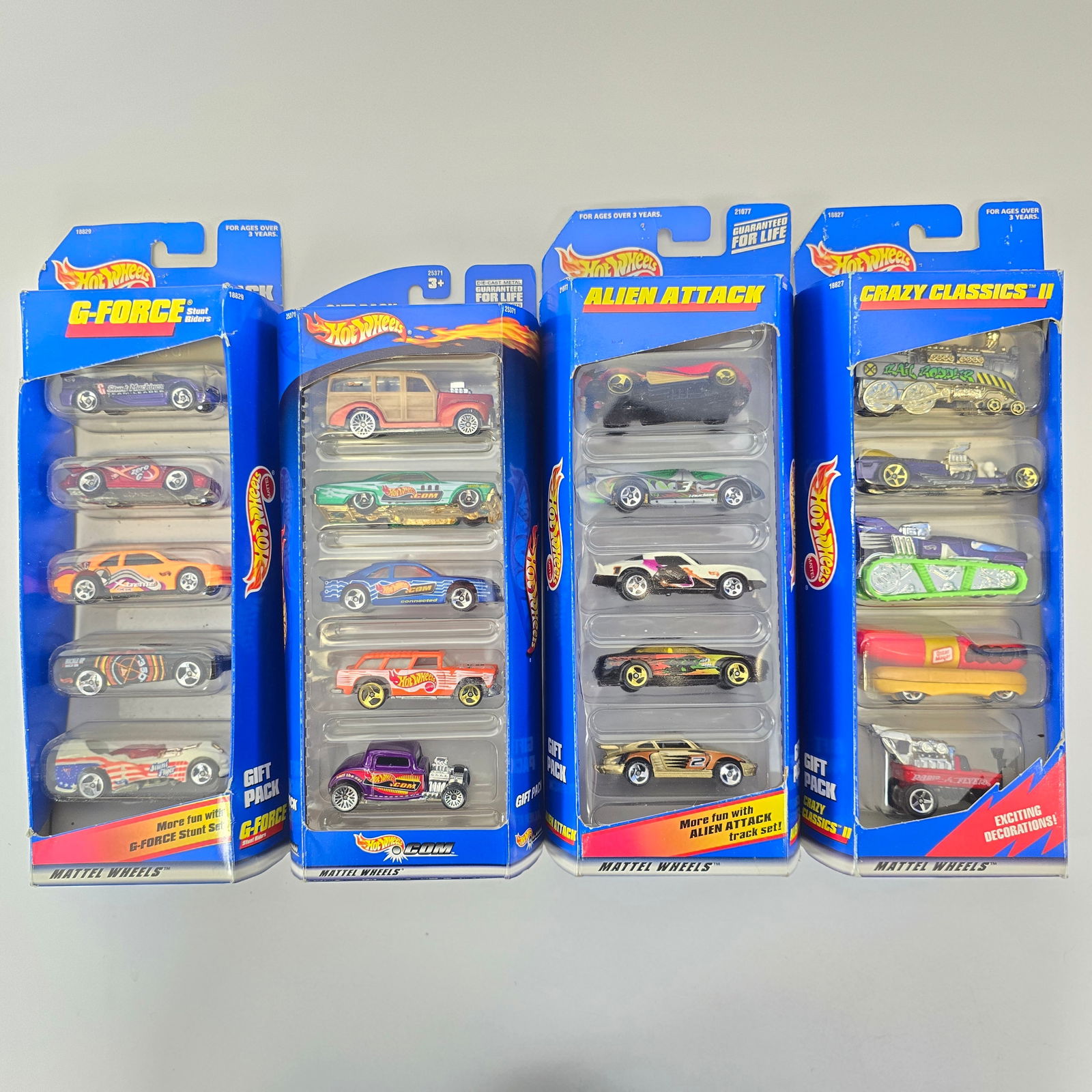 Hot Wheels Lot of 4 5-Packs: Hot Wheels Lot of 4 5-Packs including; G-Force, Hotwheels.com, Alien Attacks, and Crazy Classics II Boxes: Mostly good, some edgewear and minor tears Blisters: Clear and firmly attached