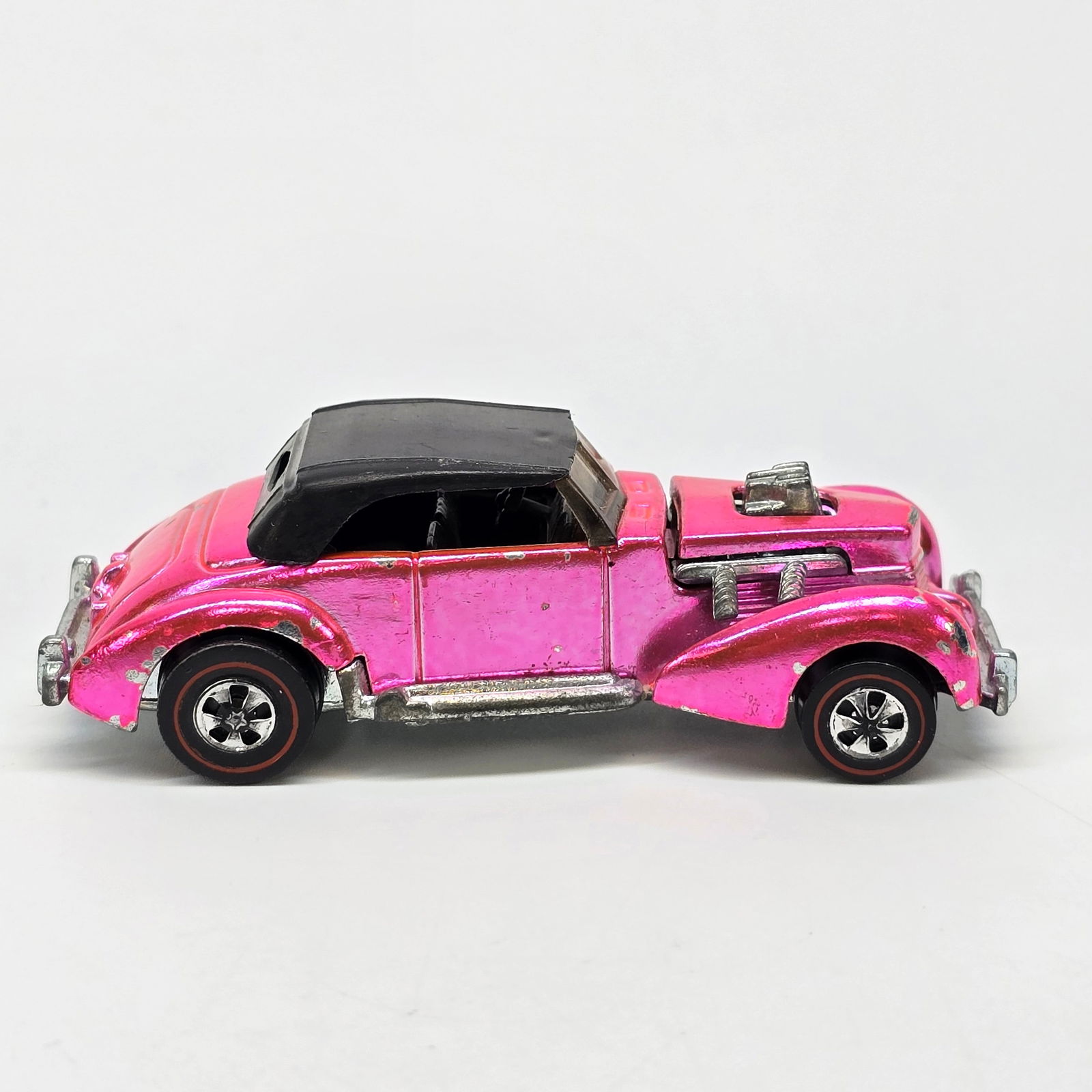 Redline Classic Cord: Hot Wheels redline Salmon Pink Classic Cord Car has nice untoned paint, it has scattered chips and wear as seen. Great wheel and suspension, clean base. It does have an original roof. The g