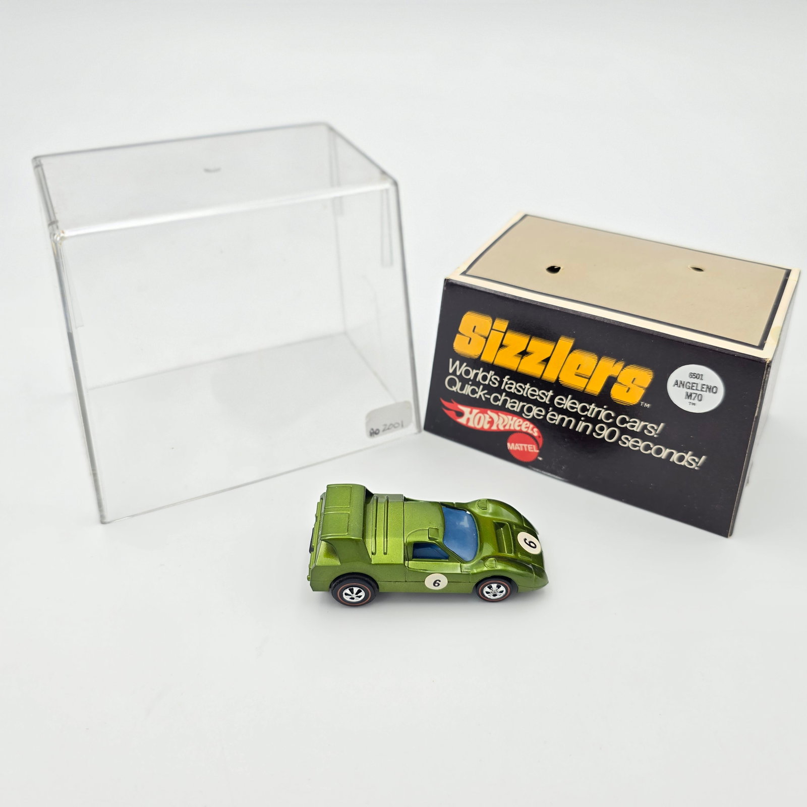 Sizzlers Angeleno: 1970 Mattel Hot Wheels Sizzlers Olive Angeleno M70 Case: clear and crack free, may have light scuffs and scratches but nothing of note, solid insert Car: excellent body color, excellent wheel chrome a