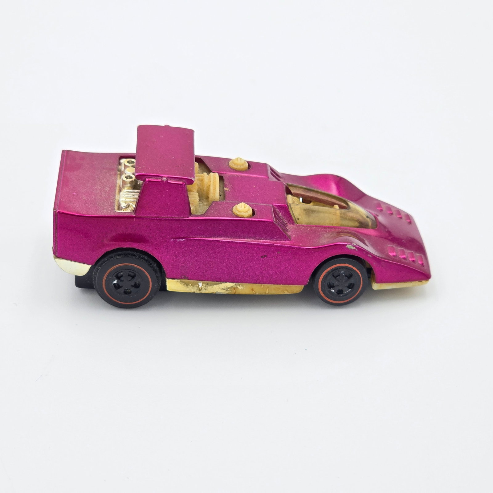 Sizzlers Spoil Sport: 1971 Mattel Hot Wheels Sizzlers magenta Spoil Sport Car: very good to excellent body color with a few small scattered spots of color loss, wheel, engine and base chrome mostly gone with the rear bumpe