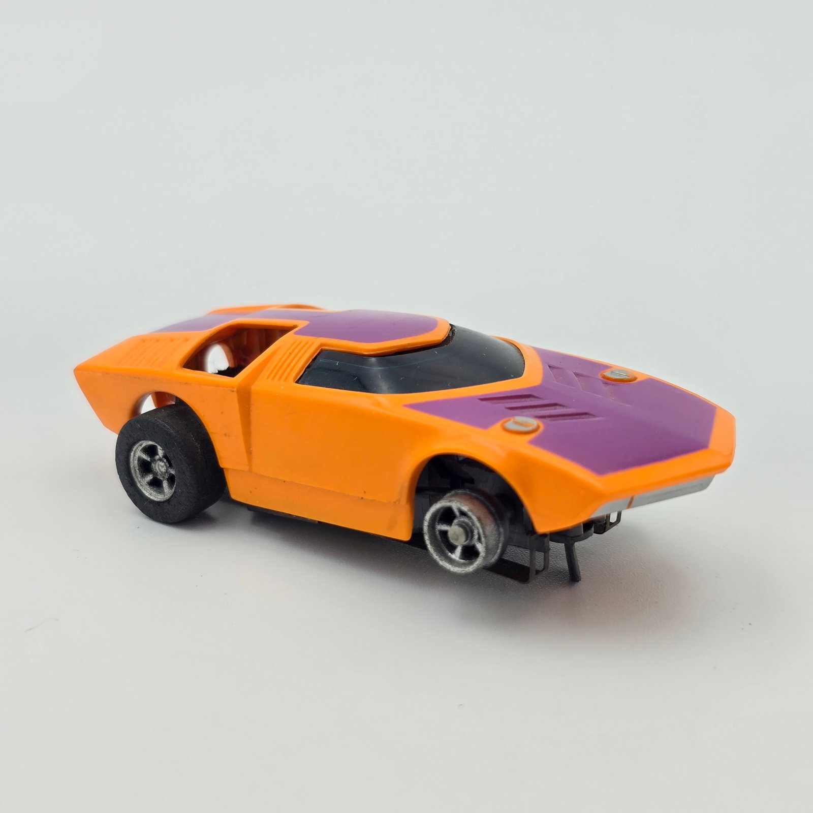 Aurora AFX Slot Car: Aurora AFX "Too Much" slot car Car is in very good condition but is missing the rear motors as seen as well as one front tire rubber, pick up shoes show wear