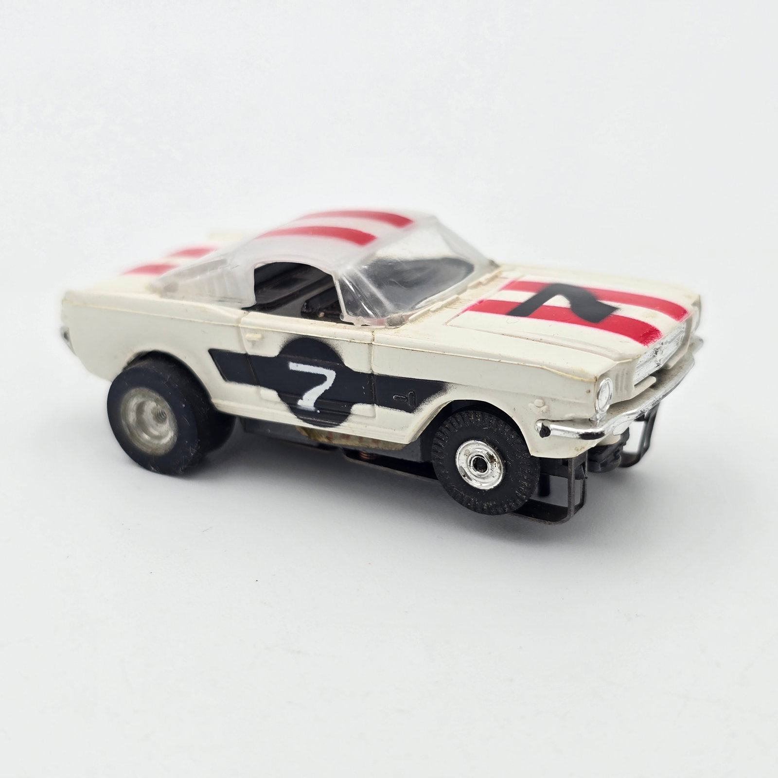 Aurora T-jet Mustang HO Slot Car: Aurora T-Jet 65 Mustang 2+2 HO Slot Car Car looks good and appears to be complete, great chrome, wheels and body, pickup shoes show light wear