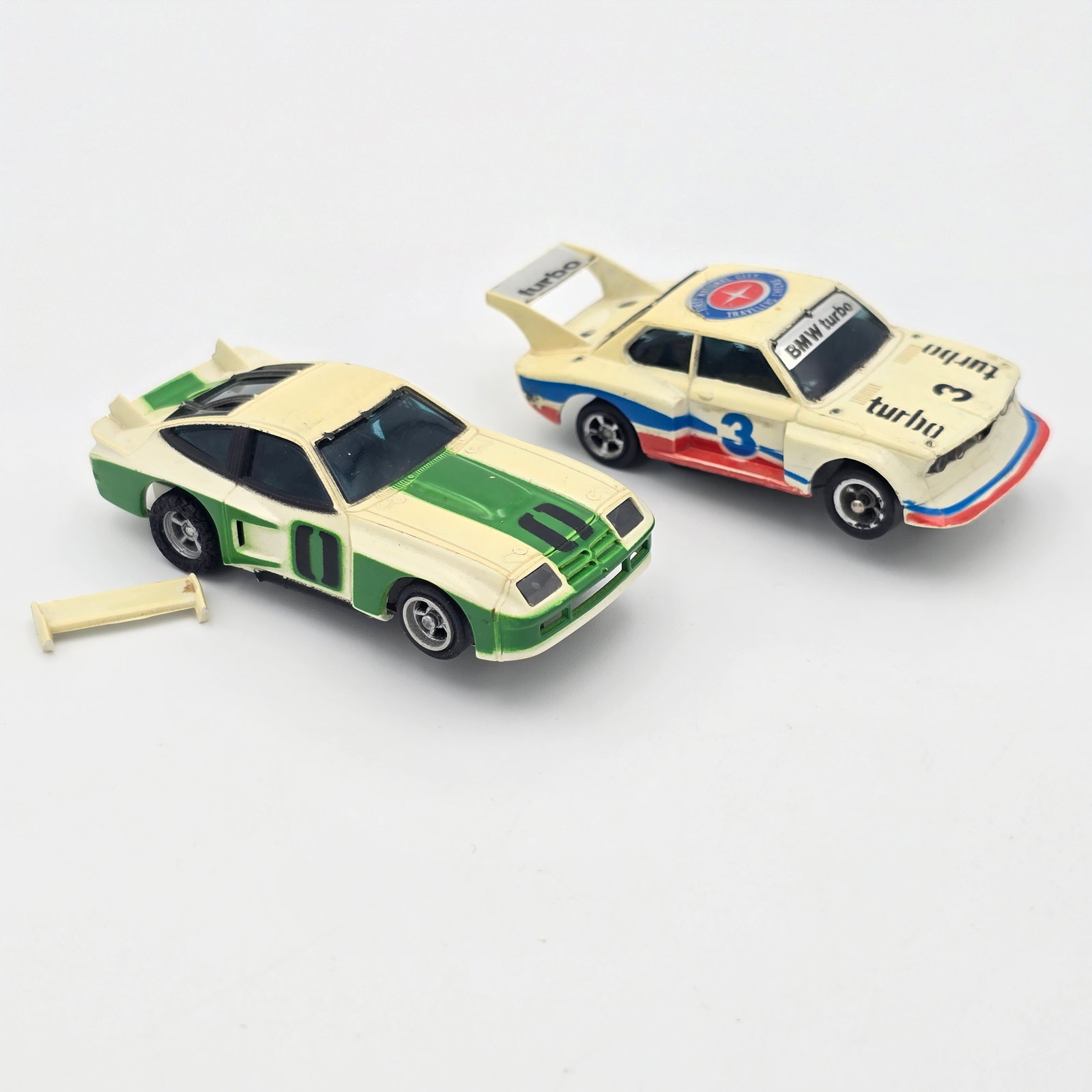 Aurora AFX Monza and BMW Slot Cars: Aurora AFX Monza and BMW Slot Cars Cars: The Monza is in good condition but rear spoiler has broken off as seen, the BMW looks to be in good condition but is missing its pickup shoes