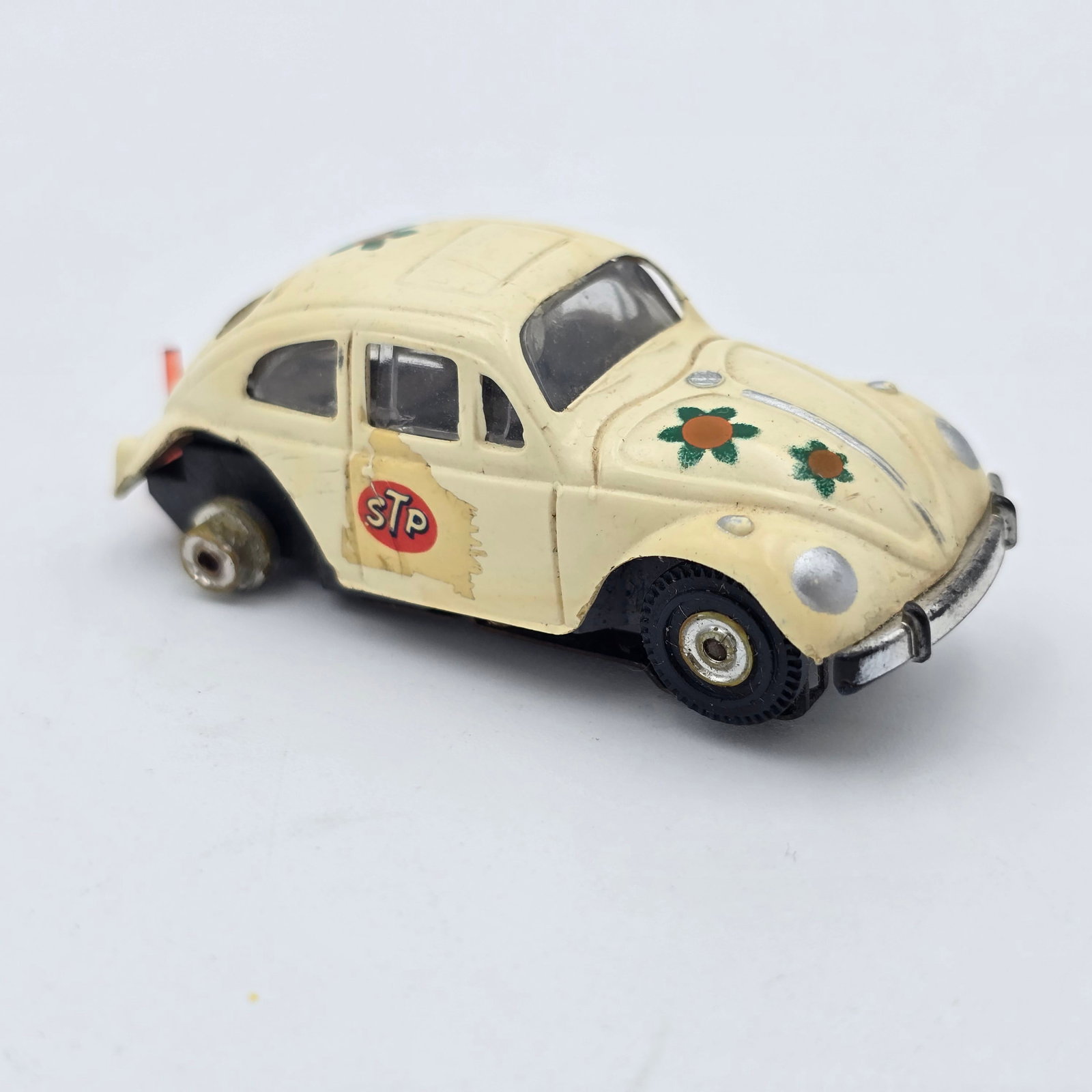 Aurora TJet VW Bug HO Slot Car: Aurora TJet VW Bug HO Slot Car Car has damage to rear, wheel wells have all been cut and trimmed as seen, rear wheel rubbers are missing