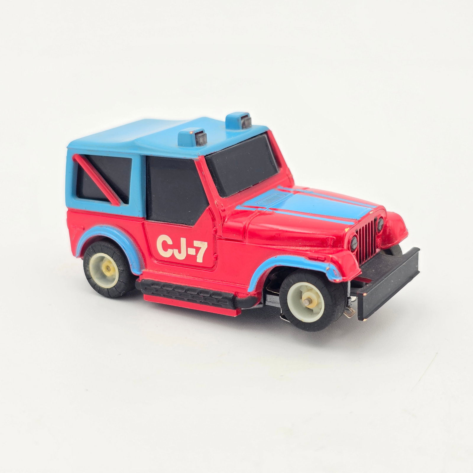 TYCO Jeep CJ-7 HO Slot Car: TYCO Jeep CJ-7 HO Slot Car Car- Looks to be in overall very good condition and complete with scattered light wear to paint in spots as seen, pickup shoes show play wear
