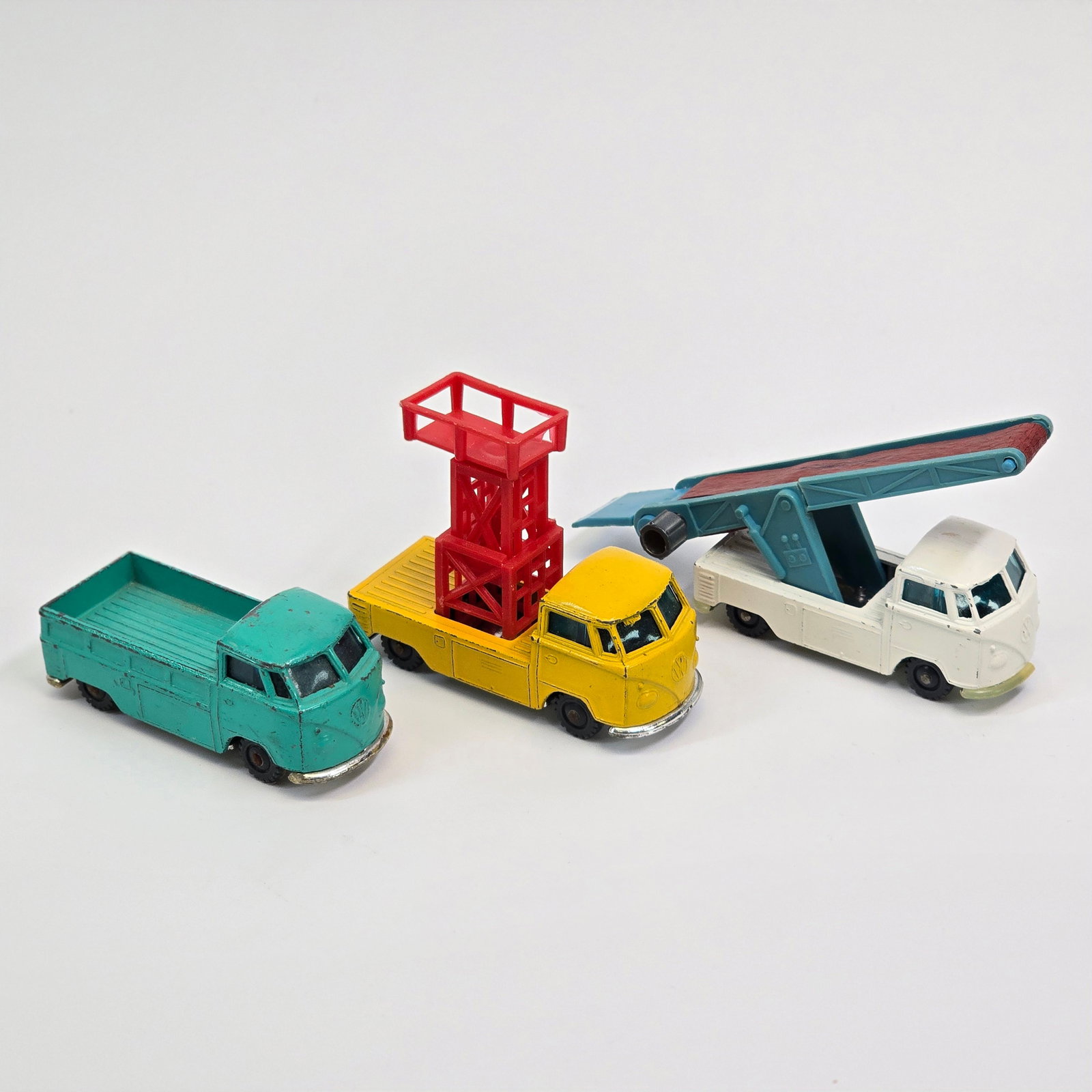 Husky VW truck trio: (3) Husky Volkswagen trucks. All three show light wear and are in overall good conditoin, however the luggage elevator does have a crack in the ramp (it does still function). The lift truck functions 