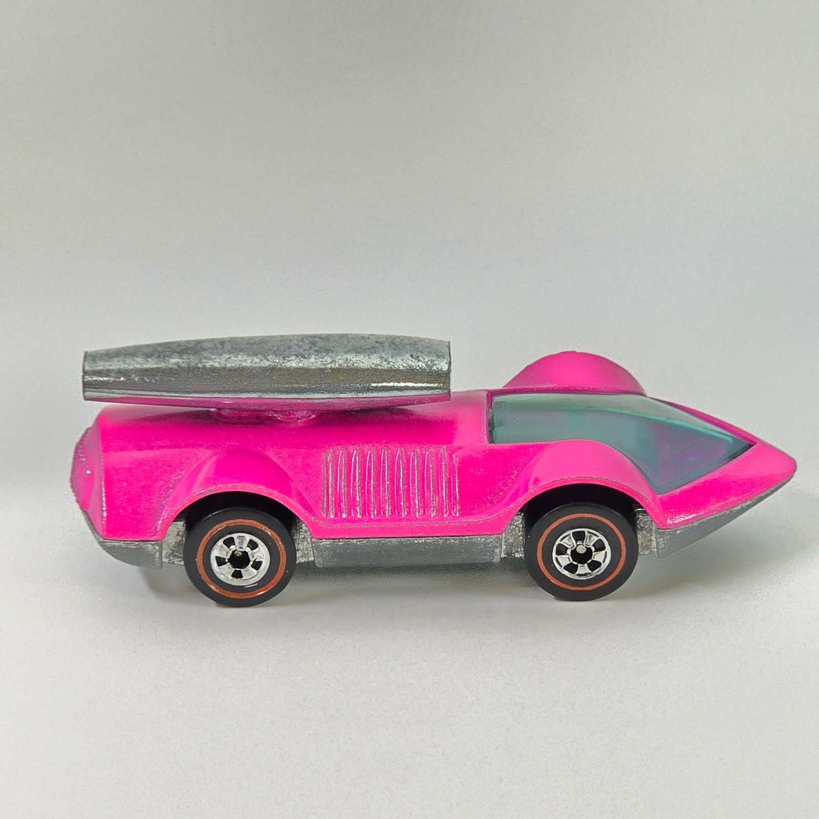 Hot Wheels Redline Rocket Bye Baby: Enamel Rocket Bye Baby - Pink - Dark interior Excellent condition overall, the only wear to the body is at the nose as seen, appears unplayed with. Glass is crack free. Wheel chrome is excellent. Base