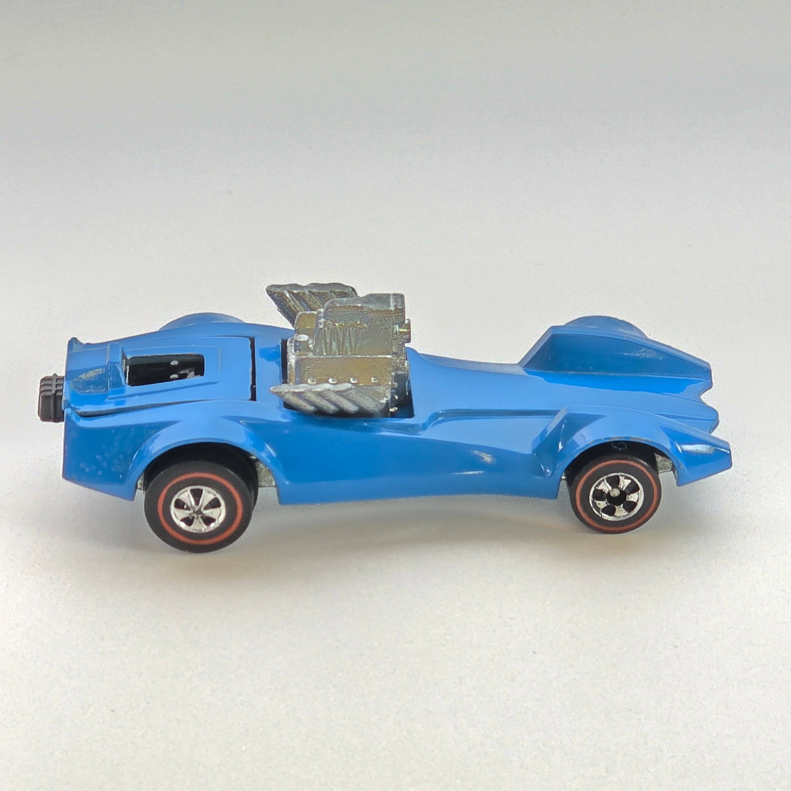 Hot Wheels Redline Strip Teaser: Enamel Strip Teaser - Light Blue - Dark interior Excellent condition overall, has just a few spots with hard edge wear at corners, appears unplayed with. Wheel chrome is excellent. Base is excellent.