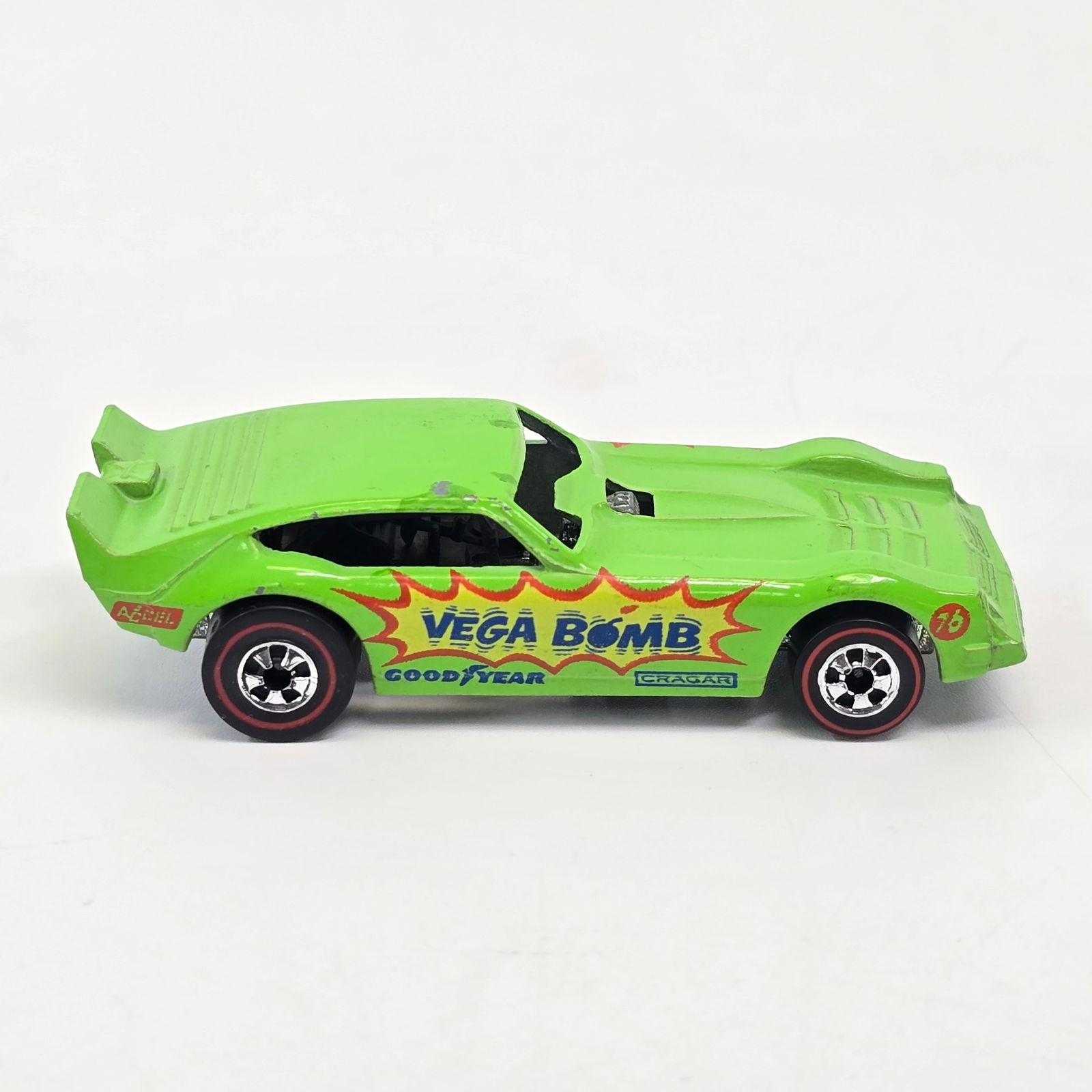 Hot Wheels Redline Vega Bomb: Flying Colors Vega Bomb Funny Car - Alternate Green - Dark interior Excellent condition however it appears to have some touch ups and chips on the roof as shown in photos, otherwise no issues of note