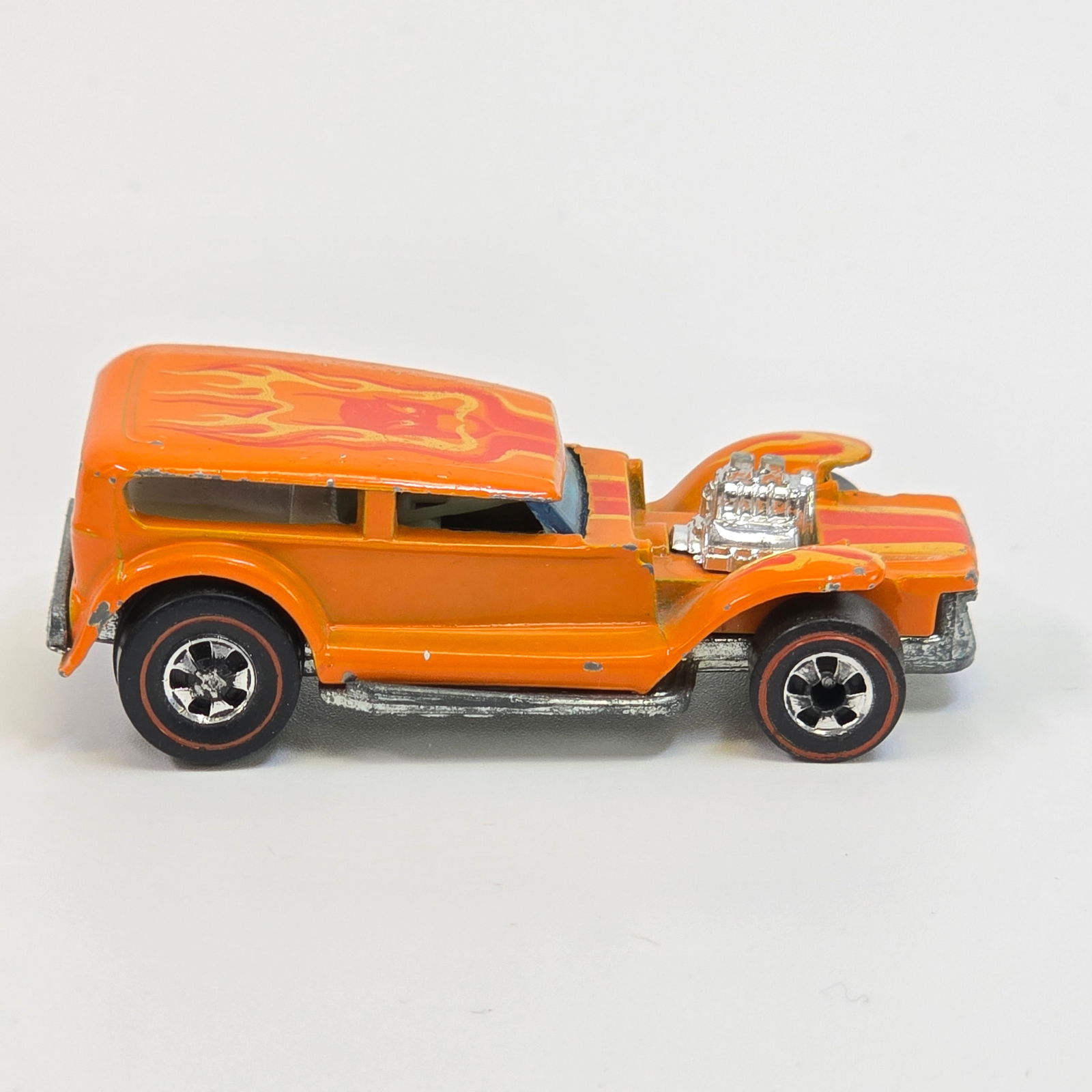 Hot Wheels Redline Prowler: Flying Colors Prowler - Orange - Dark interior Good condition with hard edge wear mainly at nose and fenders as seen. Great glass. Wheel chrome is excellent. Tampos are excellent. Base is excel