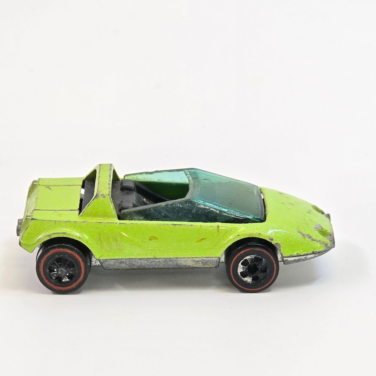 Hot Wheels Redline Sand Witch: Enamel Sand Witch - Foam Green - Dark Fair condition, has wear and chipping throughout. Good glass with some scratches and edge chips. Wheel chrome is poor and mostly gone. Base is clean with light s