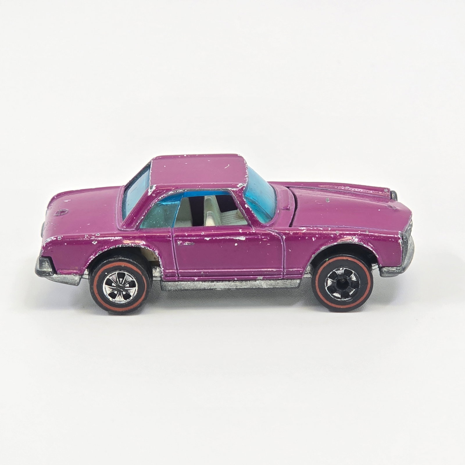 Hot Wheels Redline Mercedes 280sl: Enamel Mercedes 280sl - Plum - White interior Fair condition, has scattered chips and hard edge wear throughout as seen though nicer than the other Plum listed. Glass is cracked in front windshield as