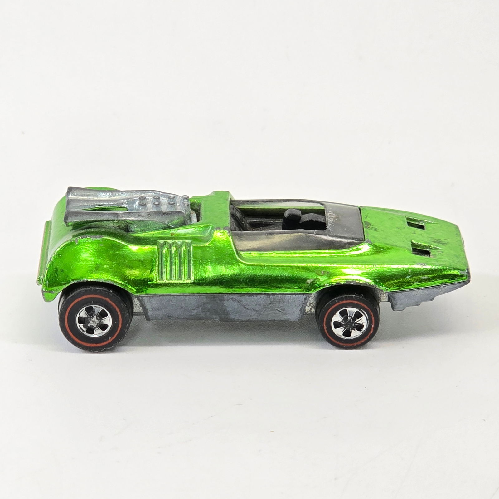 Hot Wheels Redline Peeping Bomb: Hot Wheels Redline Peeping Bomb - Light Green Overall car is very good with wispy toning in spots as seen. Has a few areas of wear at fenders, especially front passenger side. Glass has some sc