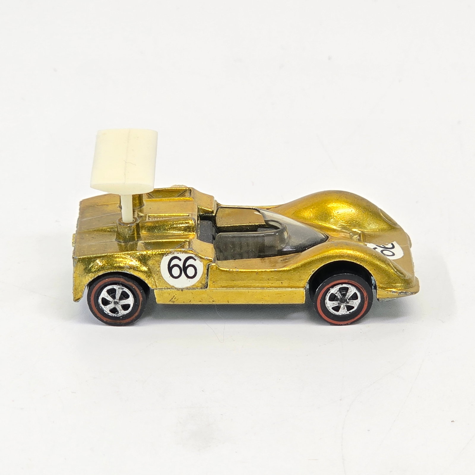 Hot Wheels Redline Chaparell 2G: Hot Wheels Redline US Chaparell 2G - Gold Overall car is excellent with little to no wear but does have toning throughout. Later release hatch with stop catch. Great glass, excellent wheel