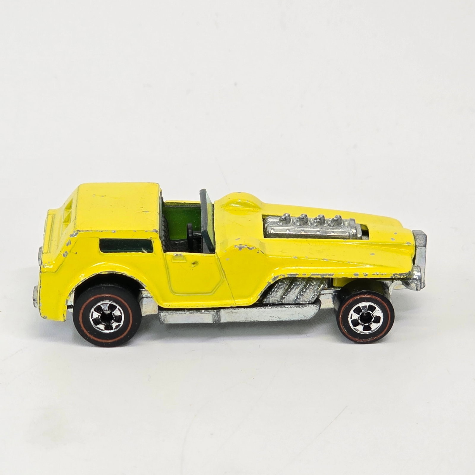 Hot Wheels Redline Hiway Robber: Hot Wheels Redline Hiway Robber - Yellow Enamel Overall car is good with hard edge wear and chipping as seen. Excellent wheels, great glass and fantastic base as seen.