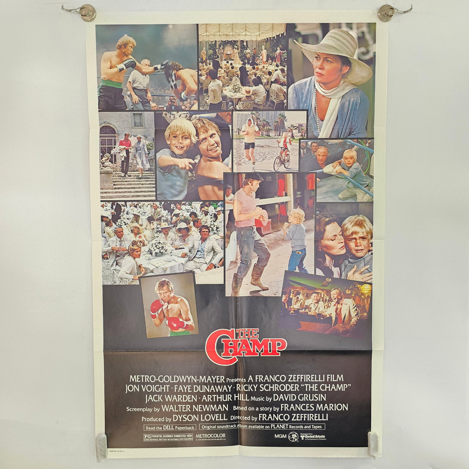 The Champ Movie Poster: 1979 The Champ Original Folded 1 Sheet Movie Poster Poster was stored folded and has subsequent creases and wear, writing on back of poster. 