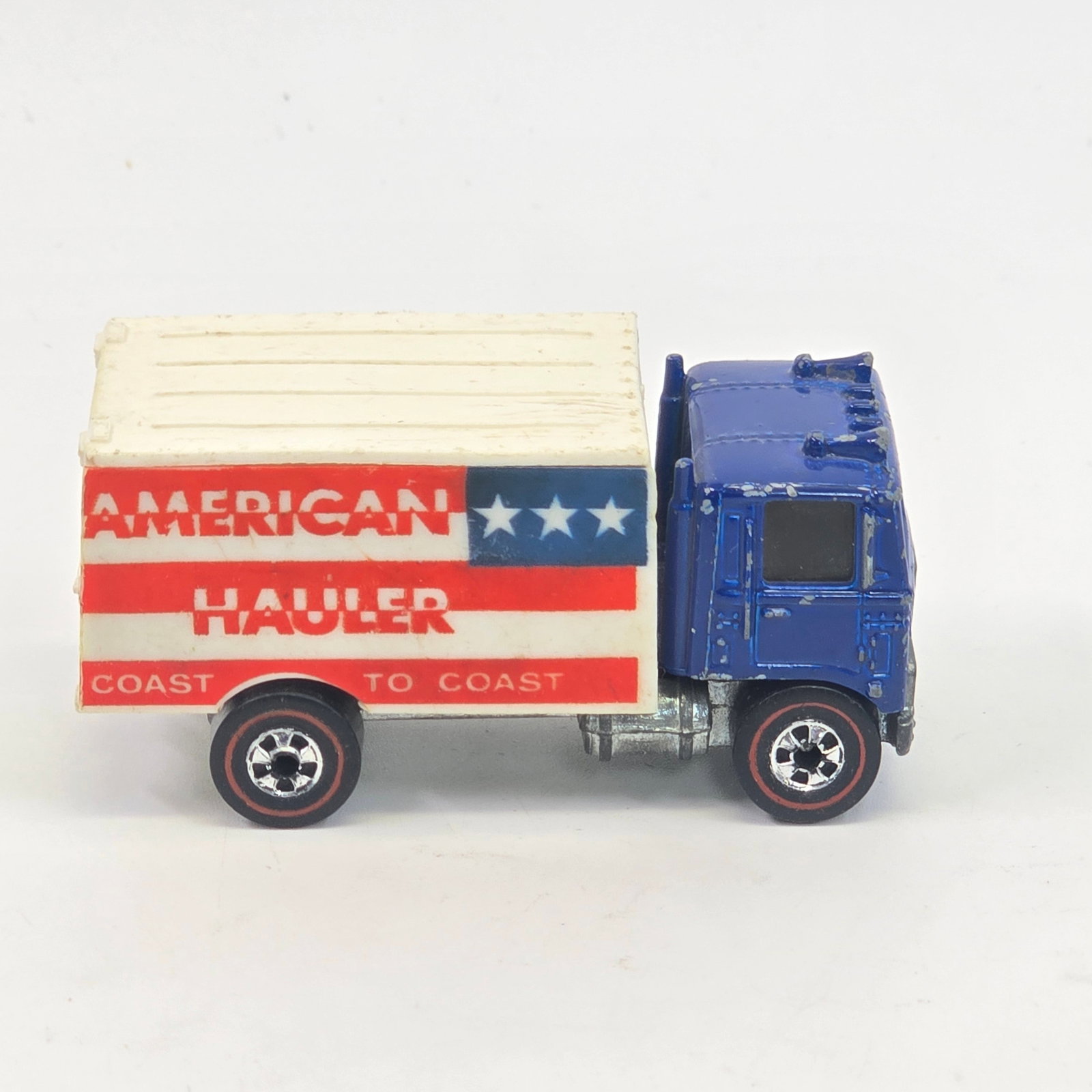 Hot Wheels Redline American Hauler: Hot Wheels Redline American Hauler Paint: Good with chips and hard edge wear as seen Tampos: Excellent Wheel Chrome: Excellent Glass: Excellent Base: Tarnished