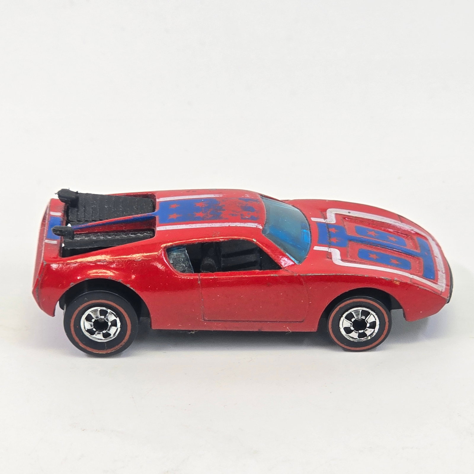 Hot Wheels Redline Warpath: Hot Wheels Redline Red Warpath Paint: Very good with a few scattered chips Tampos: Mostly good but roof has wear as seen Wheel Chrome: Excellent Glass: Excellent Base: Excellent, black plastic </