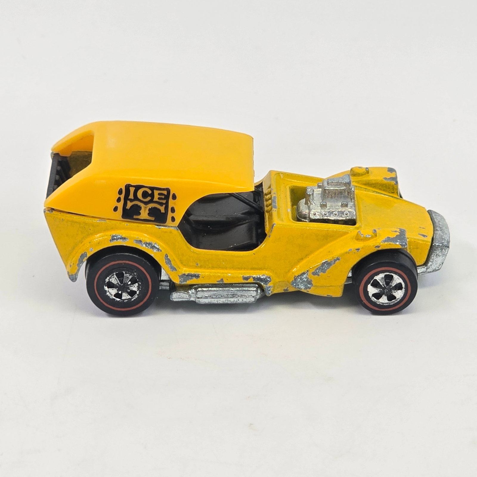 Hot Wheels Redline Ice T: Hot Wheels Redline Ice T Paint: Fair with significant loss at corners and lower edges as seen Tampos: NA Wheel Chrome: Good with light wear as seen Cap: Excellent Base: Lightly tarnished