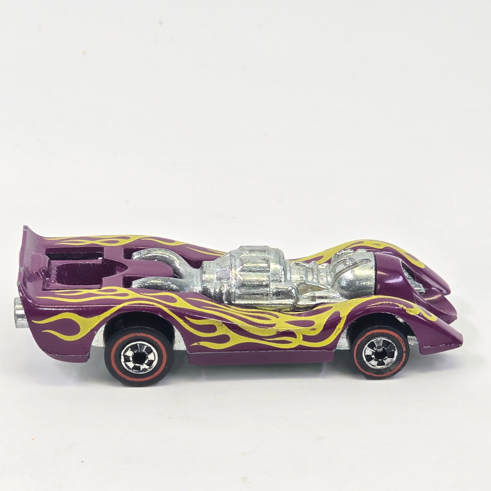 Hot Wheels Redline Jet Threat: Hot Wheels Redline Plum Jet Threat Paint: Very good with some minor hard edge wear and a few scattered chips Tampos: Very good with a few nicks Wheel Chrome: Very good with light wear in spots Glass: 