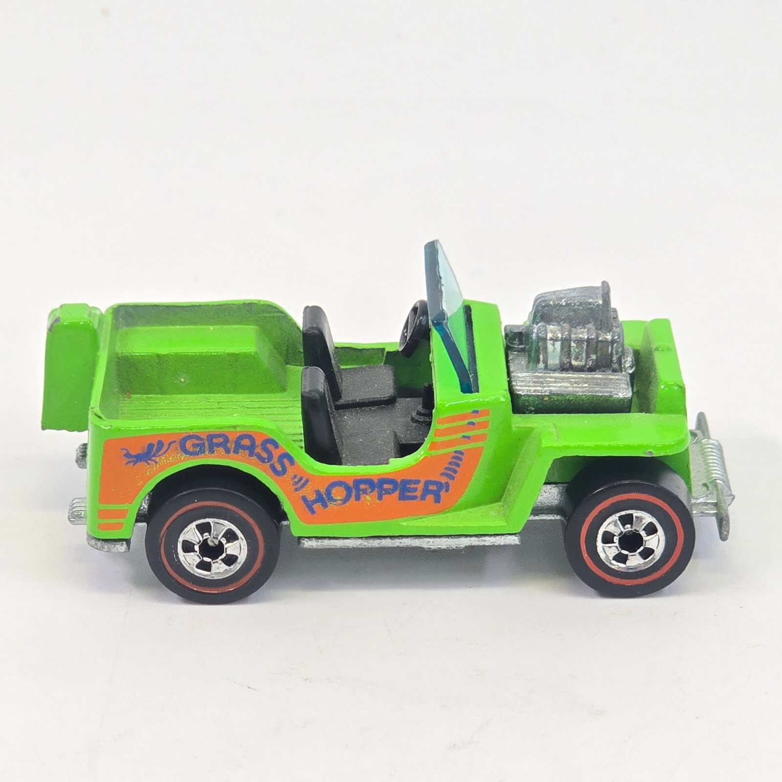 Hot Wheels Redline Grass Hopper: Hot Wheels Redline Grass Hopper Paint: Excellent, just a minor bit of wear to rear Gas Can Tampos: Excellent Wheel Chrome: Excellent Glass: Excellent Base: Excellent