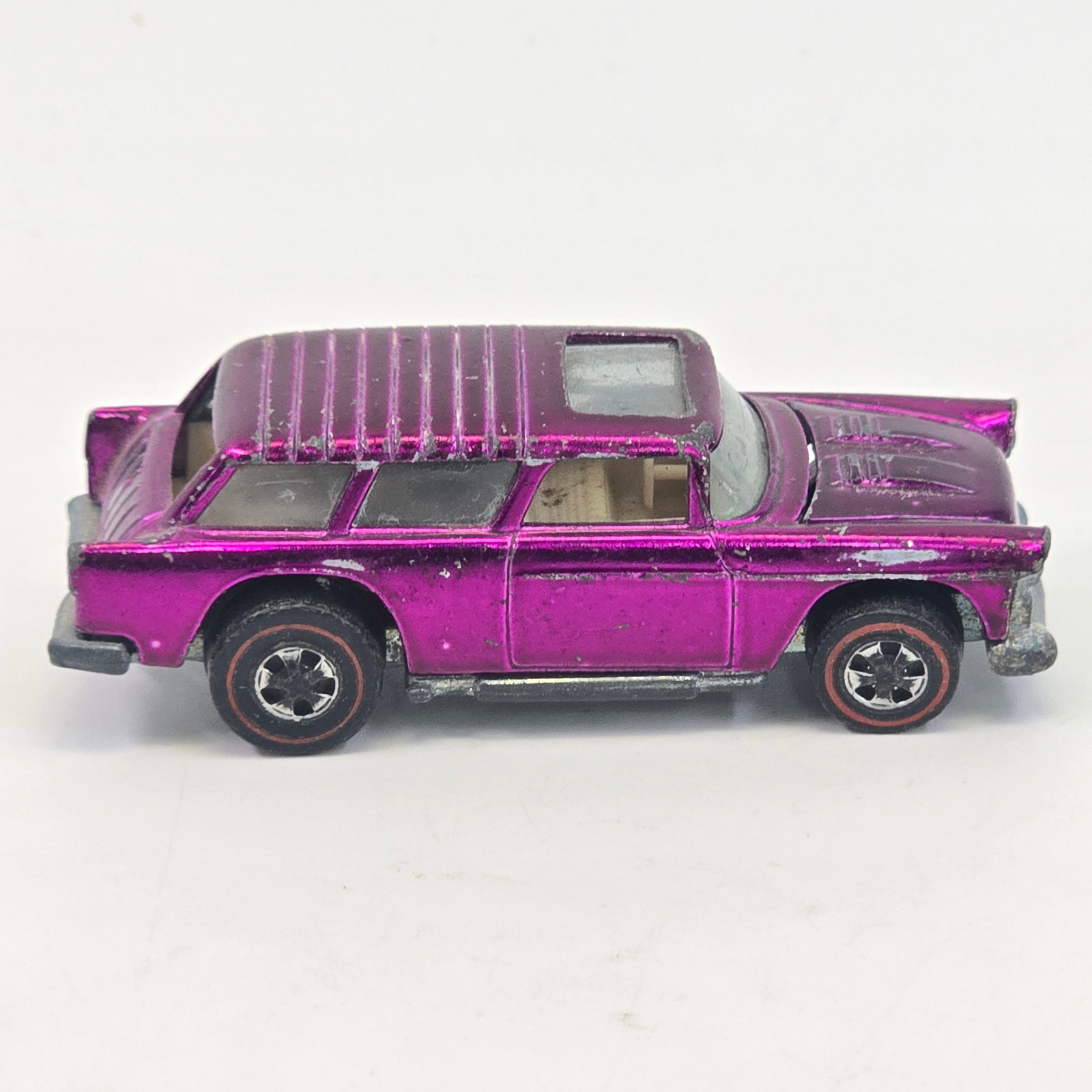 Hot Wheels Redline Nomad: Hot Wheels Redline Magenta Classic Nomad Paint: Fair with hard edge wear and scattered chips as seen Wheel Chrome: fair to poor with heavy wear to rear wheels in general Glass: Good Base: Tarnished