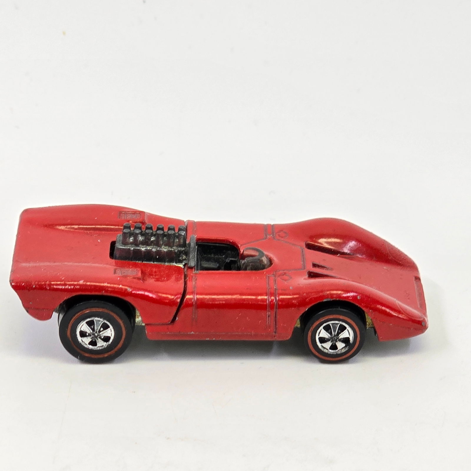 Hot Wheels Redline Ferrari: Ferrari 312P- red enamel/US/black int Paint- excellent with a few scattered micros and light wear at wheel well edges, excellent tail paint Engine/ Base- excellent, clean base and motor Glass/ Wheels-
