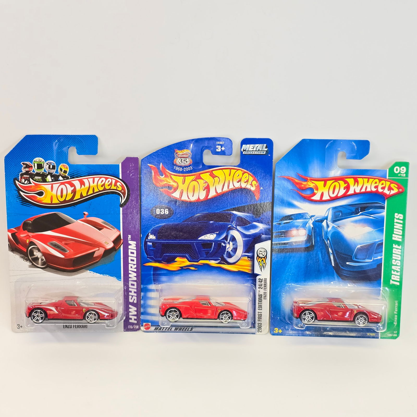 Hot Wheels Ferrari lot: Hot Wheels Mainline Ferrari lot of 3 - includes 2013 FE, TH and HW Showroom Card(s) - very good with all having minor edge and or corner curl blister(s) - all are clear, crack free and firmly attac