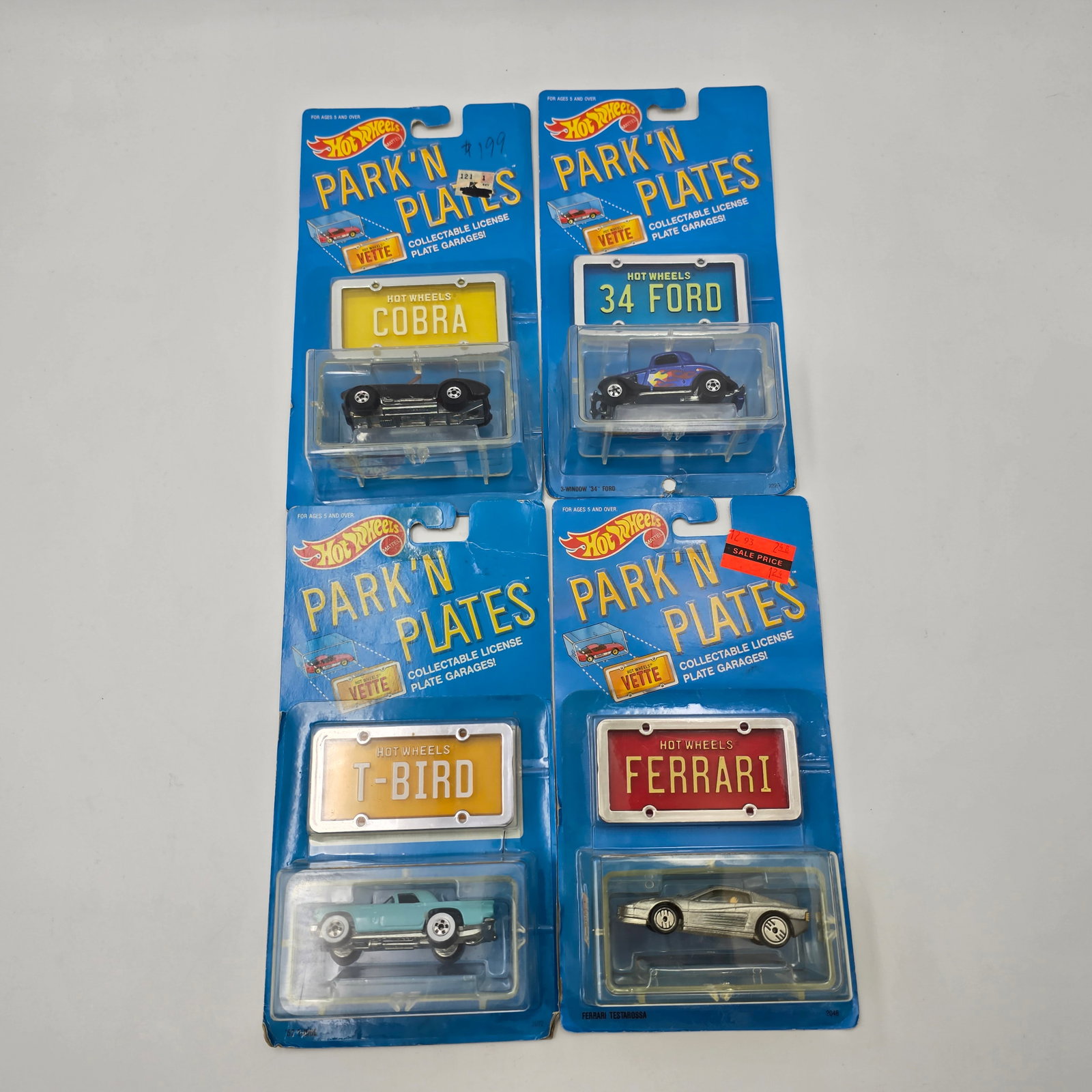 Hot Wheels Park N Plates lot of 4: Hot Wheels Park N Plates lot of 4, includes - 57 T-Bird, Ferrari, 34 Ford and Shelby Cobra Car: Cars are excellent with no issues of note Cards: are fair with varying degrees of edge and corner wear, 