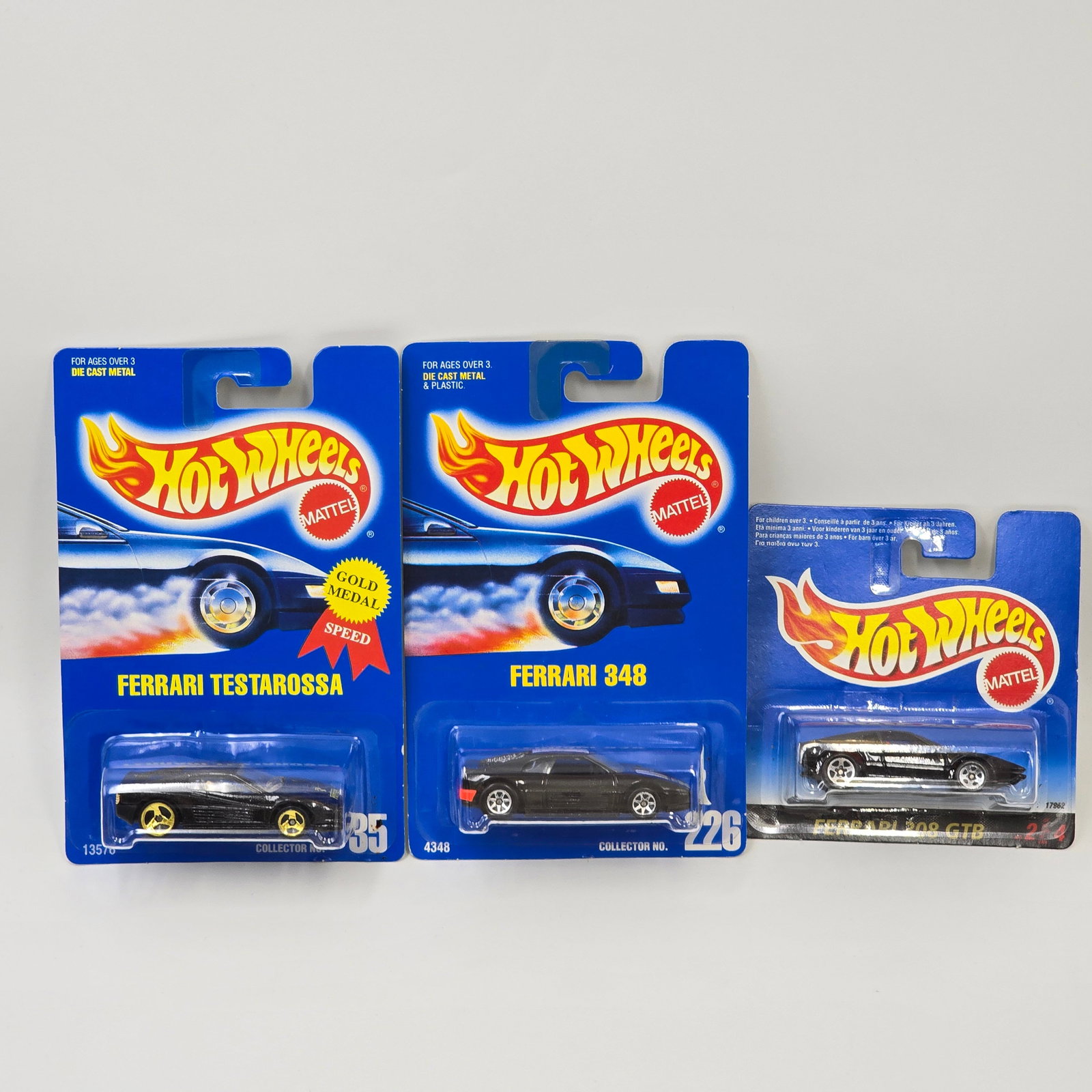 Hot Wheels Ferrari Lot of 3: Hot Wheels Ferrari lot of 3, includes - Blue Card #35 Ferrari Testarossa with gold 3 spoke wheels, Blue Card #226 Ferrari 348 and International Short Card Ferrari 308 GTB Cars: Excellent with no issue