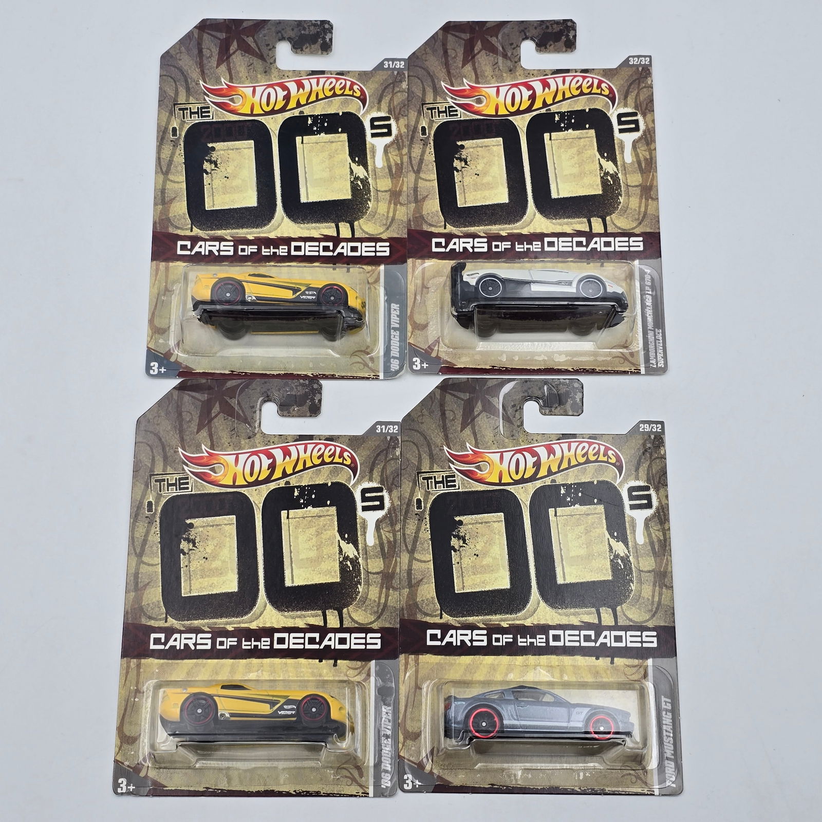 Hot Wheels Cars of the Decades lot of 4: Hot Wheels '00's Cars of the Decades lot of 4, includes - (2) 06 Dodge Vipers, Ford Mustang GT and Lamborghini Murcielago All cars appear excellent with no issues of note Cards are good but may have s