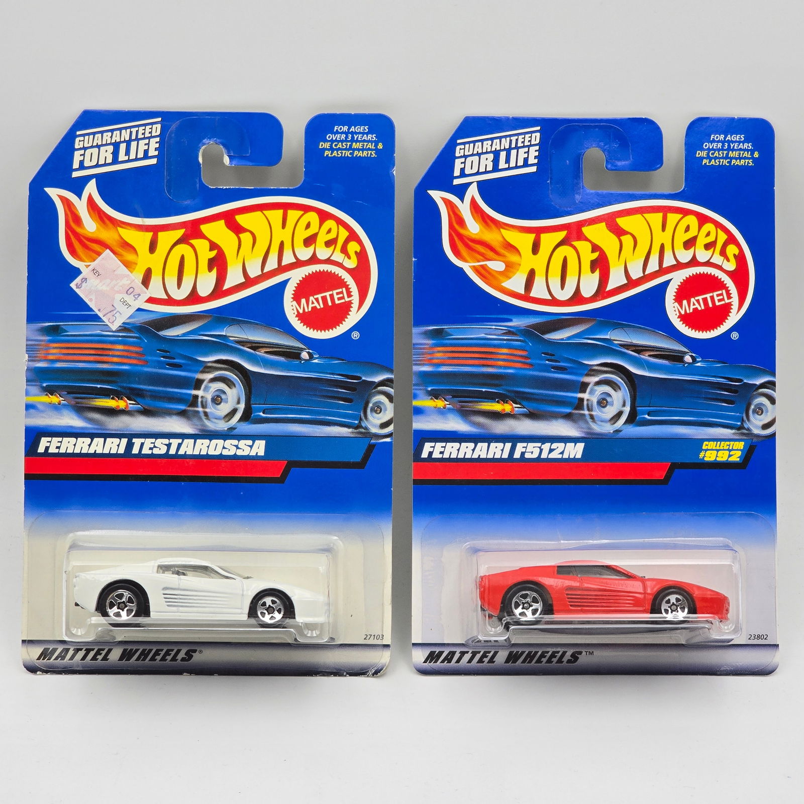 Hot Wheels Ferrari Pair: Hot Wheels Ferrari Pair, includes - white Ferrari Testarossa and a red Ferrari F512M All cars appear excellent with no issues of note Cards are good but may have scattered spots of corner and edgewear