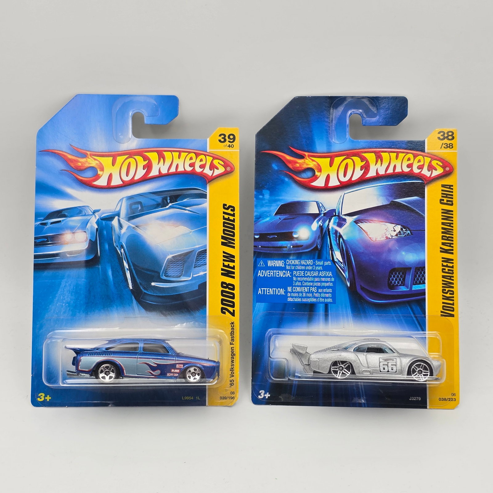 Hot Wheels Volkswagen Karmann Ghia Pair: Hot Wheels Volkswagen Karmann Ghia Pair, includes - 2008 65 Volkswagen Fastback and Racing Volkswagen Karmann Ghia Cars are excellent with no issues Cards appear excellent but may have edge and/or