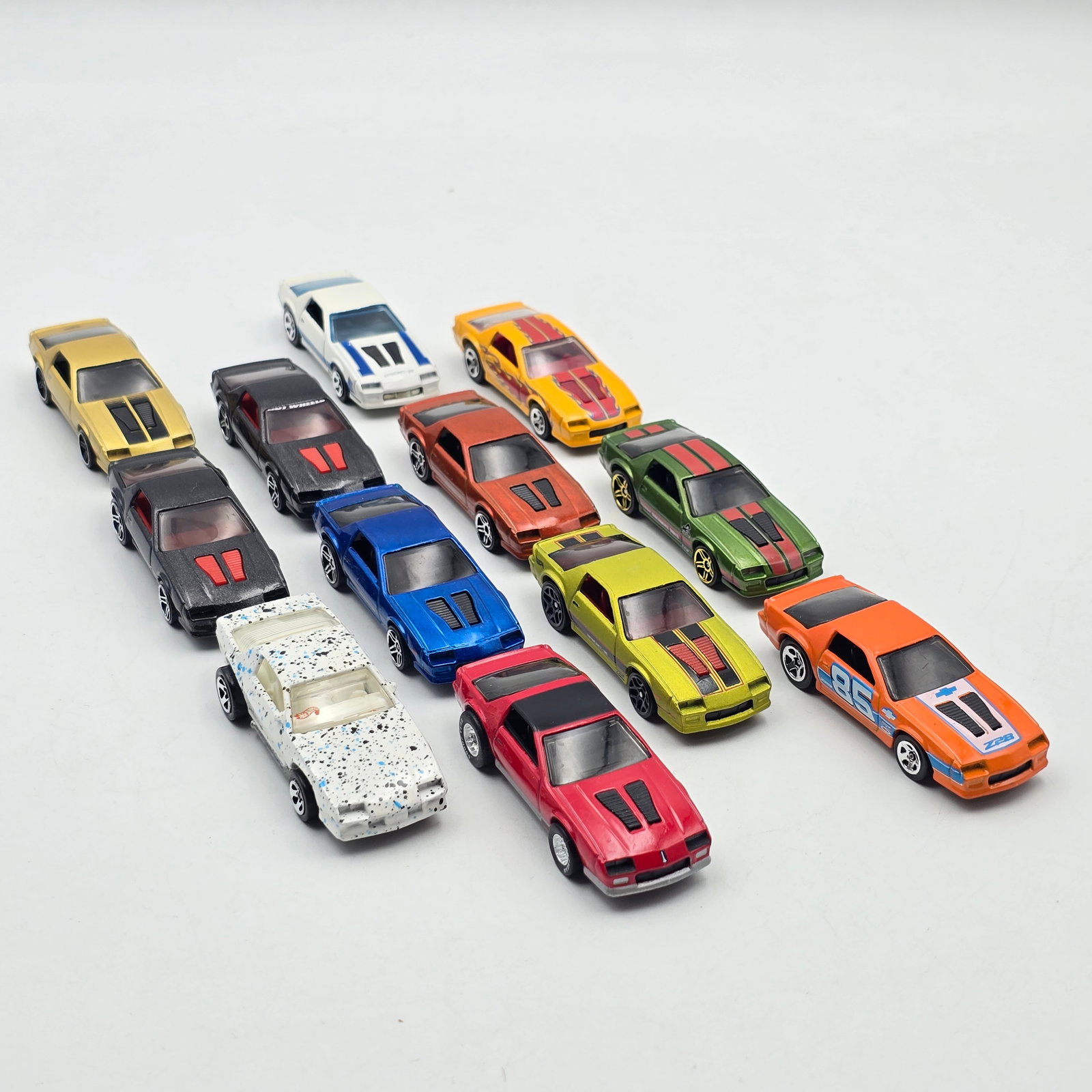 Hot Wheels 85 Camaro Lot: Hot Wheels 80's Camaro lot of 12 Includes a mix of 80's Camaros as seen All appear to be good condition with no issues of note Please check photos for complete description