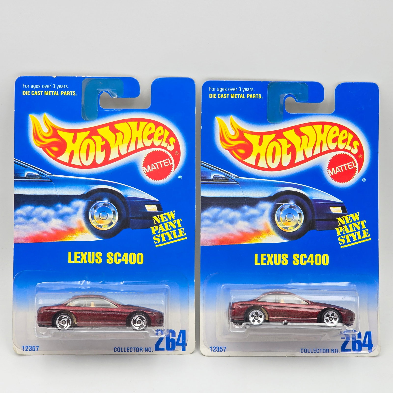 Hot Wheels Lexus SC400 Pair: Hot Wheels #264 Lexus SC400 Pair Two different wheel variations included - 3 - spoke and 5 - spoke Cars appear to be in good condition with no issues of note Cards are in good shape, may have minor ed