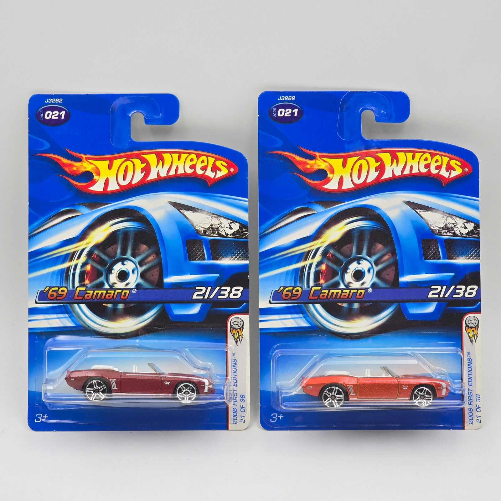 Hot Wheels 69 Camaro Pair: Hot Wheels 2006 FE 69 Camaro Convertible Pair One each dark and light red, both have PR5 wheels Cars appear to bein good condition with no issues of note Cards are in good shape, may have mino
